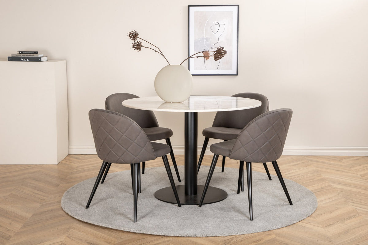 Rundes Esszimmerset aus grauen Velvet-Stühlen mit schwarzen Beinen und weissem Marmortisch mit schwarzem Metalluntergestell.