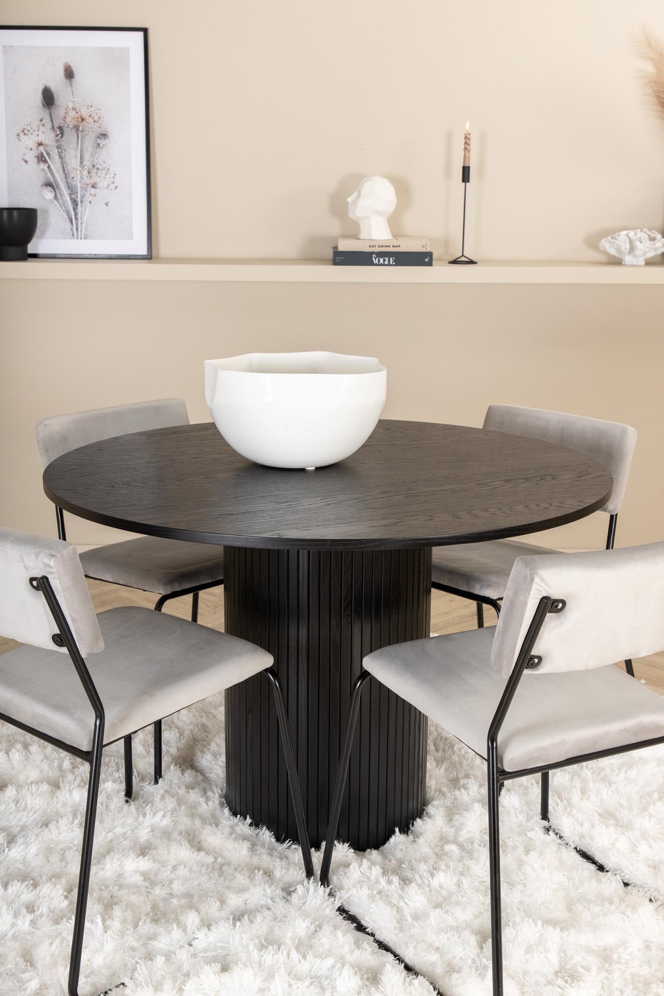 Elegantes Esszimmerset mit schwarzem MDF-Tisch und 4 stilvollen Samtstühlen in Grau. Perfekt für gemütliche Familienessen und gesellige Abende.