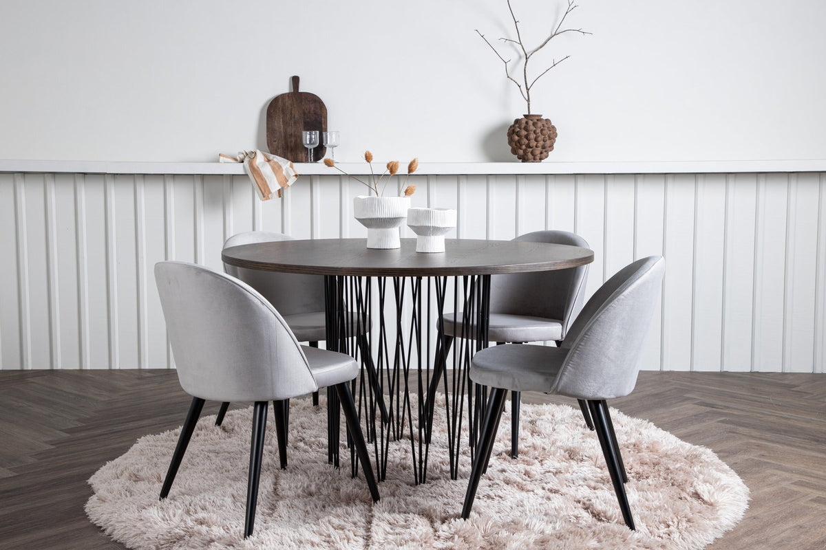 Rundes Esszimmerset mit Steinlook-Tisch aus MDF und Mocca-Furnier, schwarzem Metallgestell und vier Limhamn-Stühlen mit beigem Samtbezug.