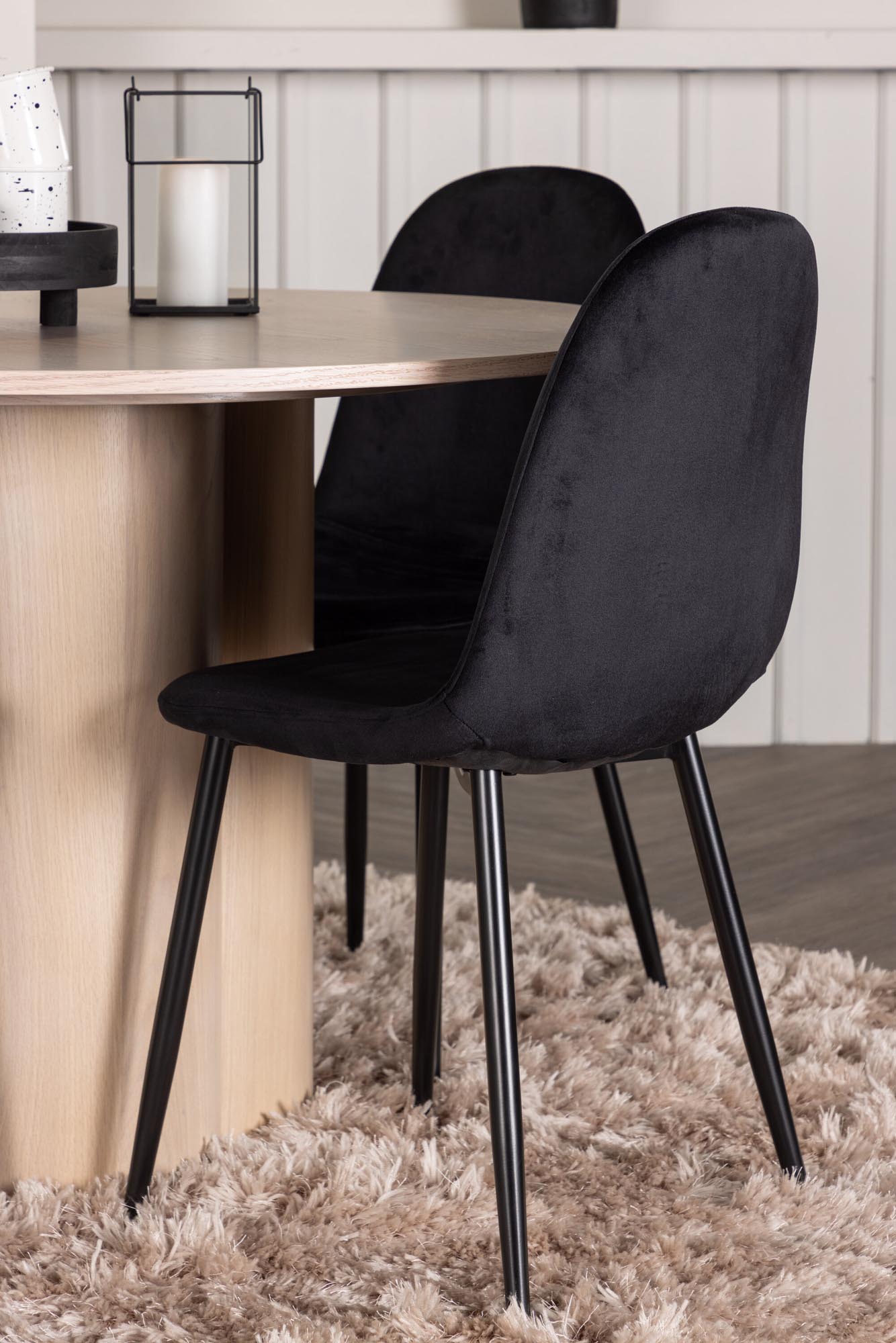 Elegantes Olivia Esszimmer Set mit runder Tischplatte und 4 komfortablen Samt-Stühlen. Ideal für gesellige Abende und stilvolle Einrichtung.