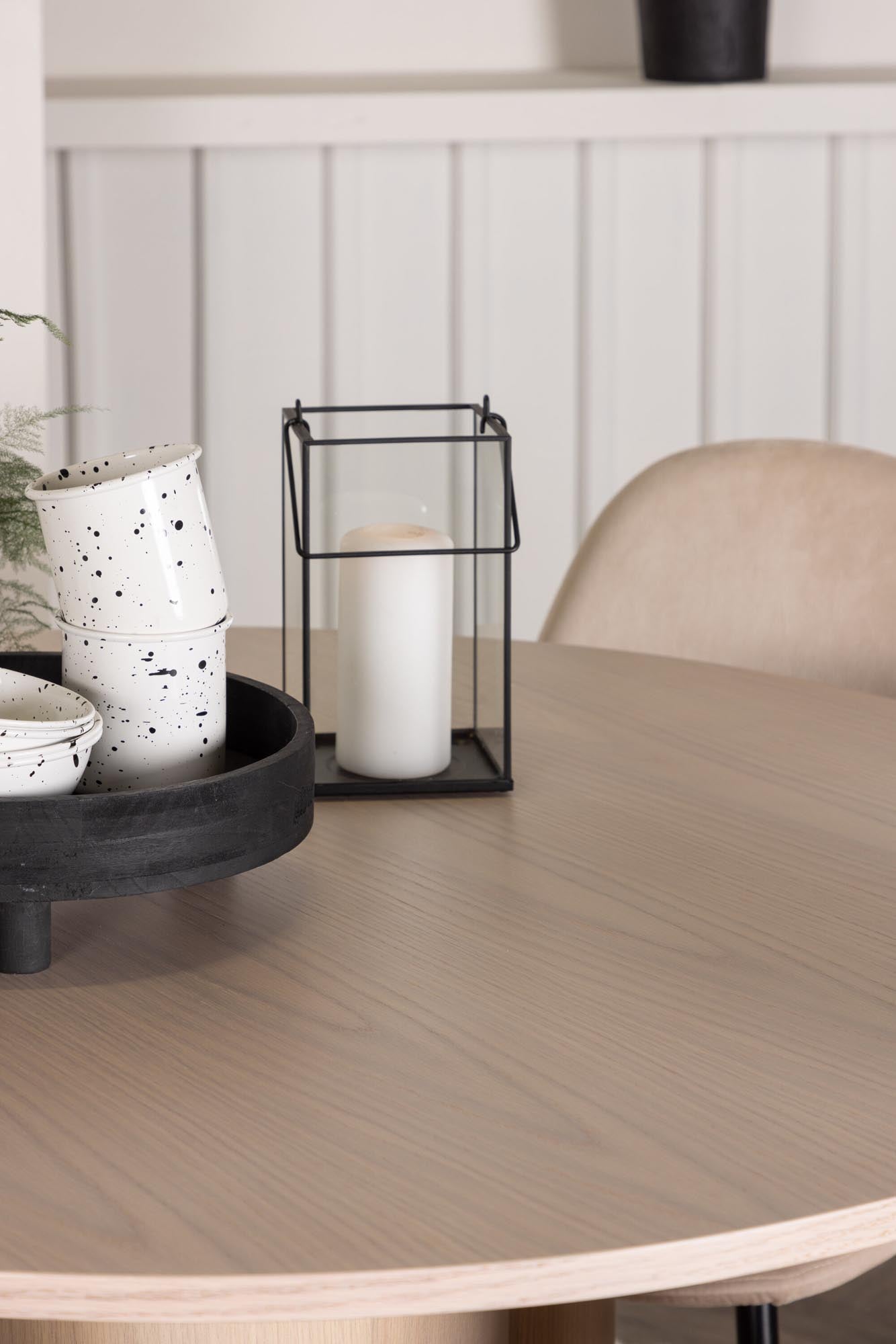 Elegantes Esszimmer Set mit skandinavischem Design: runder Tisch und 4 bequeme Samt-Stühle für gesellige Abende.