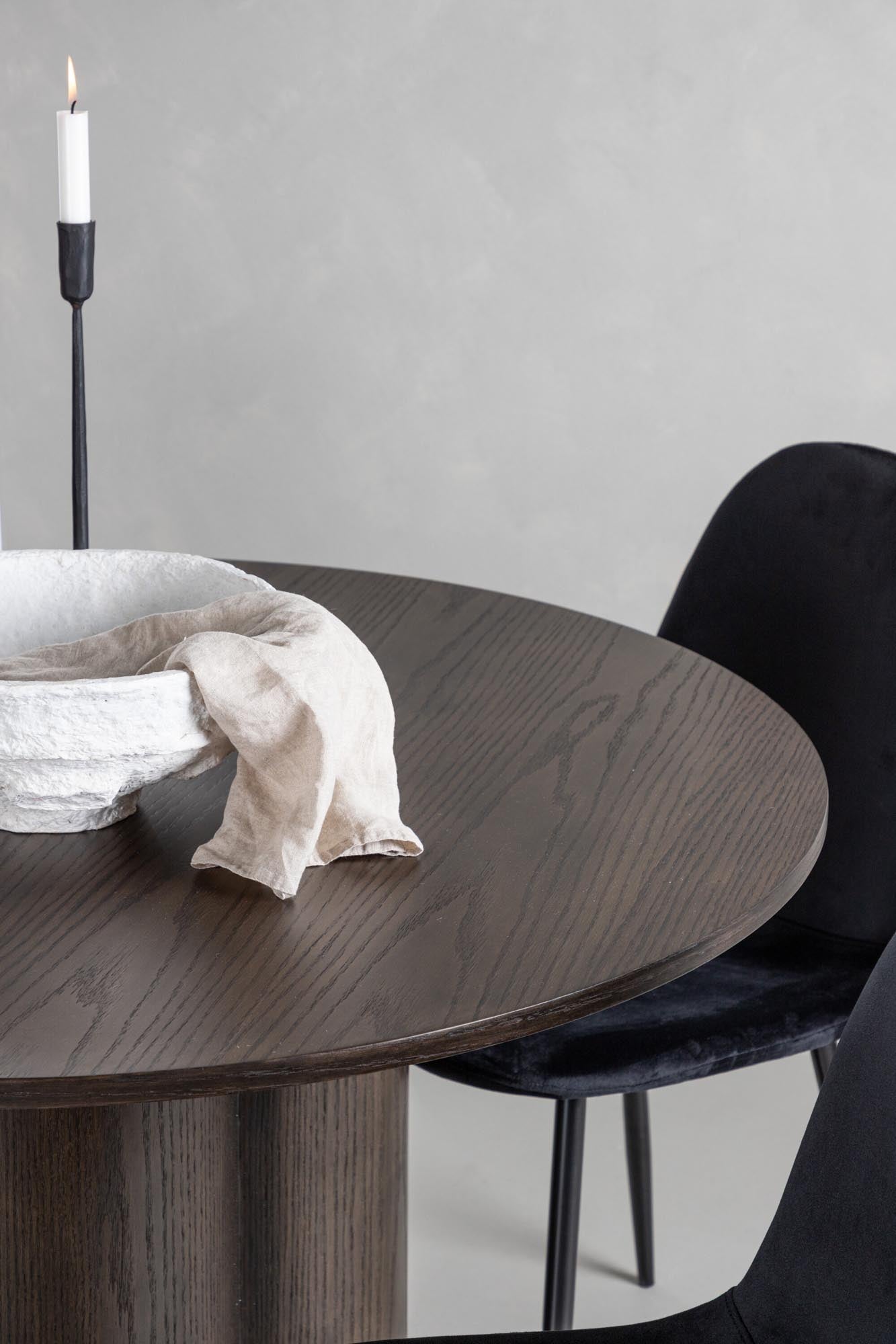 Stilvolles Olivia Esszimmer Set mit runder Tischplatte und bequemen Polar-Stühlen. Perfekt für gesellige Abende und einladende Atmosphäre.