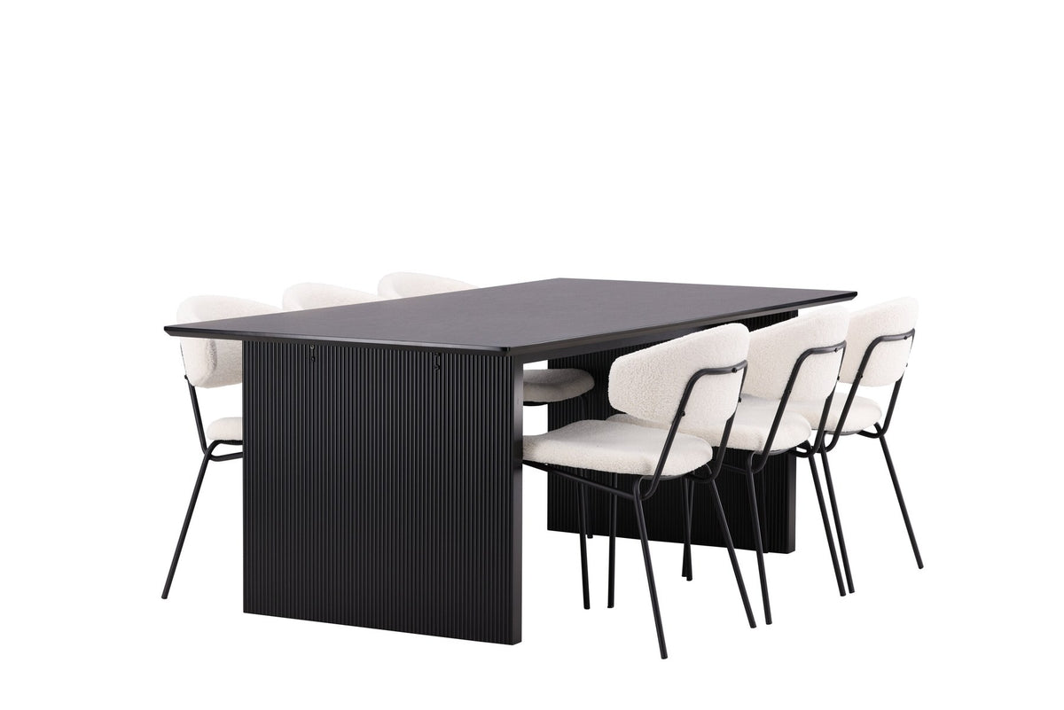 Esszimmerset aus rechteckigem MDF-Tisch in Rauchschwarz mit sechs Limhamn-Stühlen, beiger Samtbezug, muschelförmige Rückenlehne, schwarze Metallbeine.