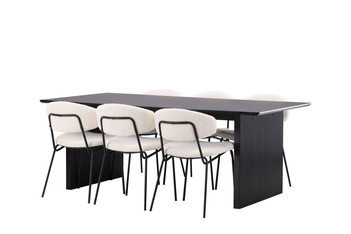 Esszimmerset aus rechteckigem MDF-Tisch in Rauchschwarz mit sechs Limhamn-Stühlen, beiger Samtbezug, muschelförmige Rückenlehne, schwarze Metallbeine.