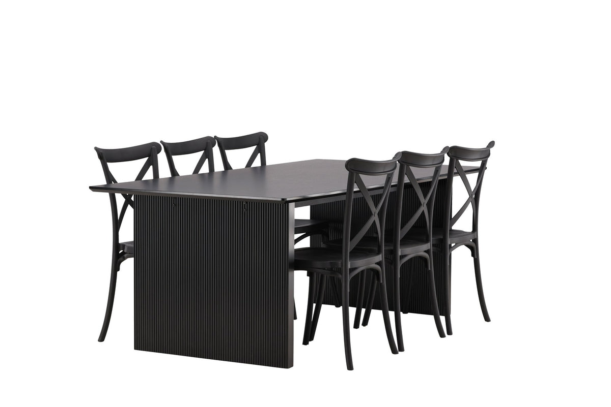 Esszimmerset aus rechteckigem MDF-Tisch in Rauchschwarz mit sechs Limhamn-Stühlen, beiger Samtbezug, muschelförmige Rückenlehne, schwarze Metallbeine.