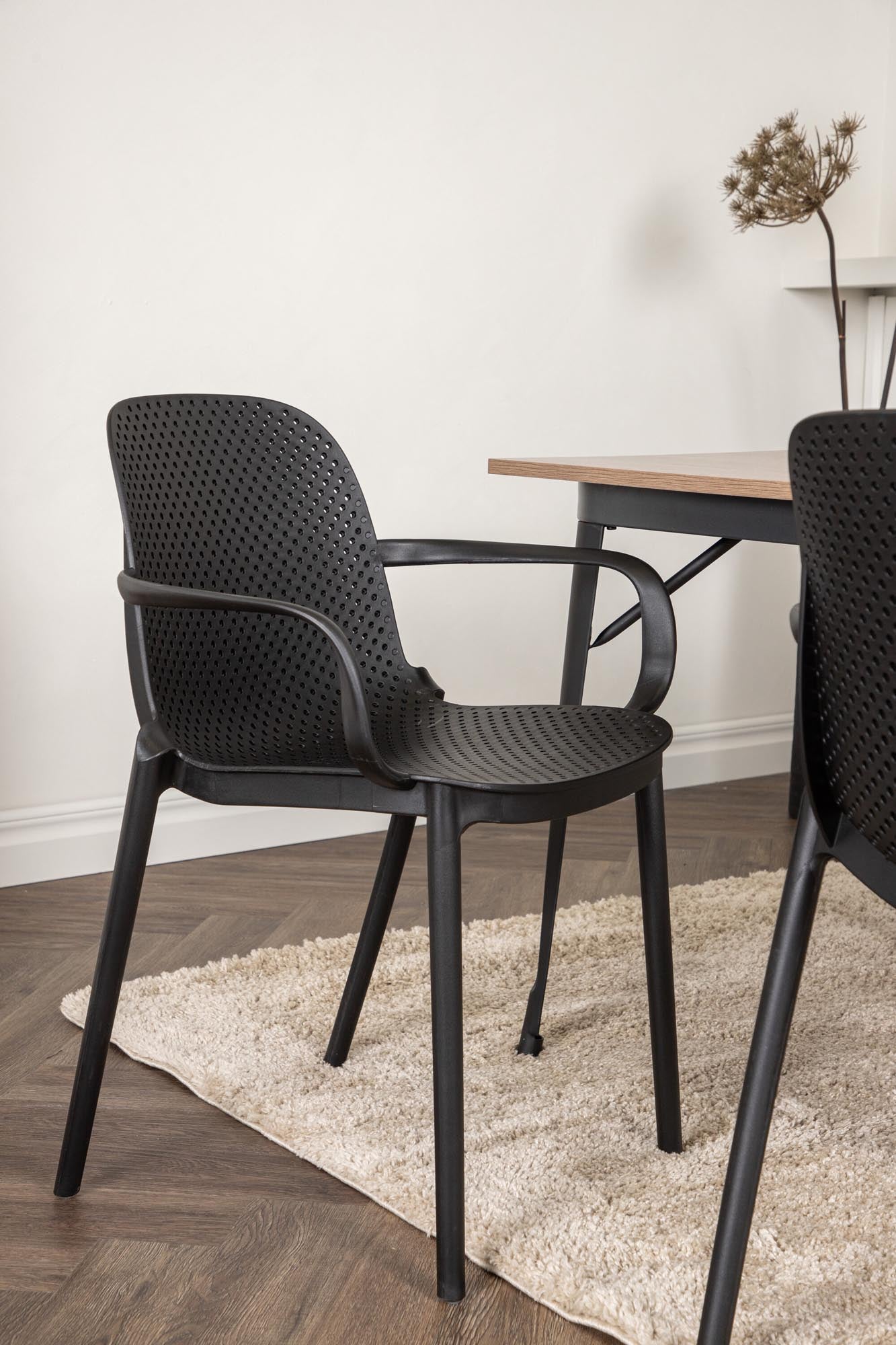 Elegantes Esszimmerset mit 140 cm Tisch aus schwarzem MDF und robusten Stühlen. Perfekt für stilvolle Dinner und gesellige Abende.