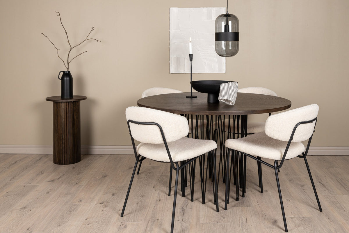 Rundes Esszimmerset mit Steinlook-Tisch aus MDF und Mocca-Furnier, schwarzem Metallgestell und vier Limhamn-Stühlen mit beigem Samtbezug.