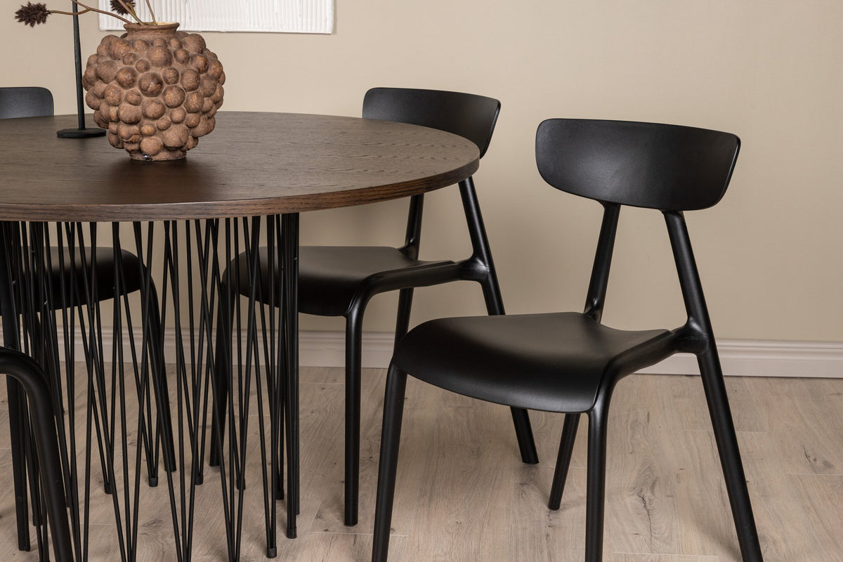 Rundes Esszimmerset mit Steinlook-Tisch aus MDF und Mocca-Furnier, schwarzem Metallgestell und vier Limhamn-Stühlen mit beigem Samtbezug.