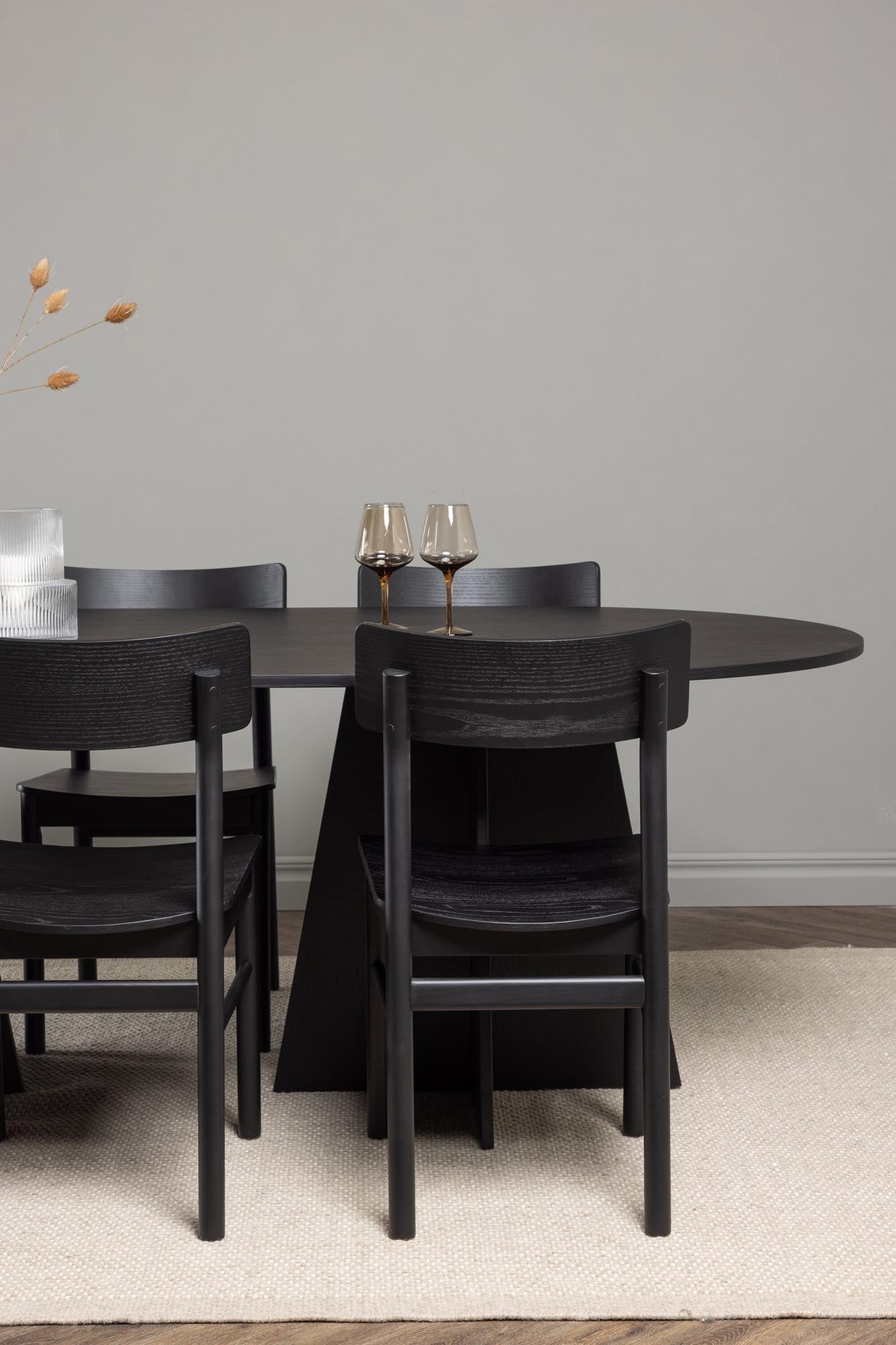 Eleganter Bootcut Esstisch mit 6 Montros Stühlen von Venture Home.