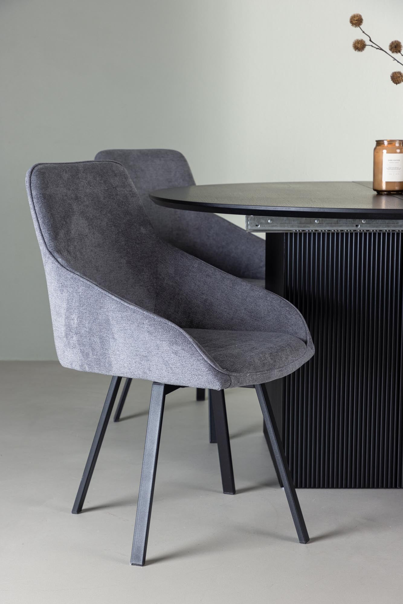 Modernes Matilda Esszimmerset mit ausziehbarem Tisch (⌀130cm) und 4 stilvollen Rosie Stühlen für einladende Dinner und gesellige Abende.