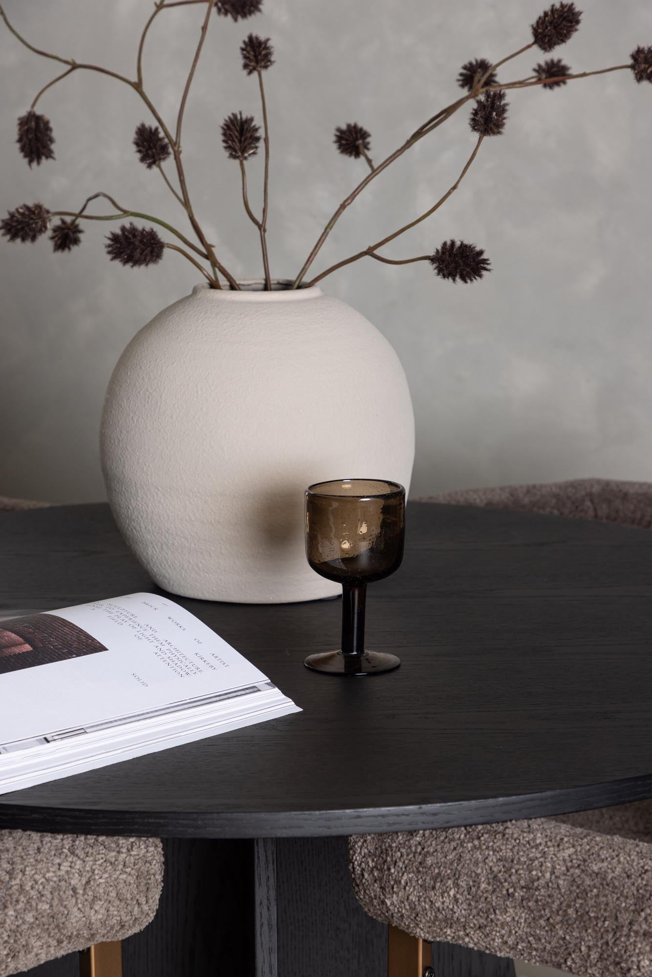 Stilvolles Bootcut Esszimmerset mit runden Tisch und 4 eleganten Stühlen, ideal für gemütliche Familienabende und gesellige Zusammenkünfte.