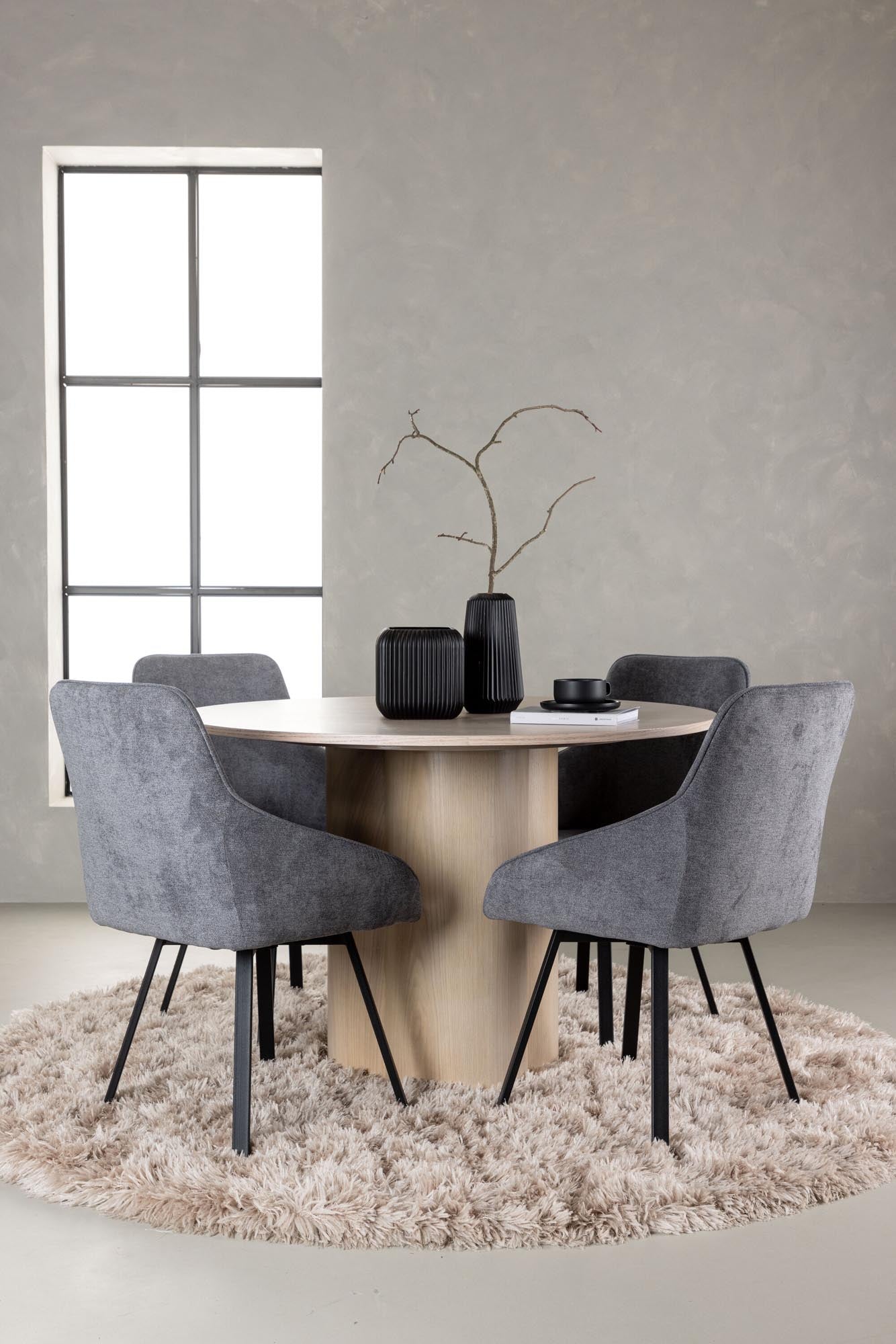 Entdecken Sie das stilvolle Olivia Esszimmerset + Rosie: Runder Tisch mit 110 cm Durchmesser und 4 eleganten Stühlen für jeden Anlass.