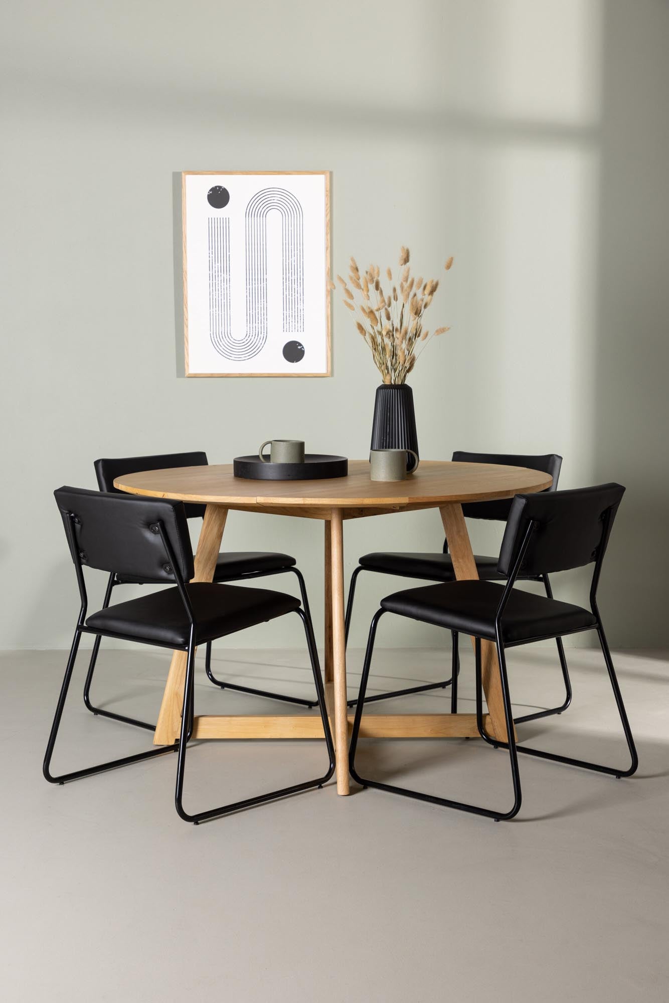 Stilvolles Yadikon Esszimmerset mit runden Tisch und 4 modernen Kenth-Stühlen. Ideal für gesellige Momente und einladende Esszimmer.