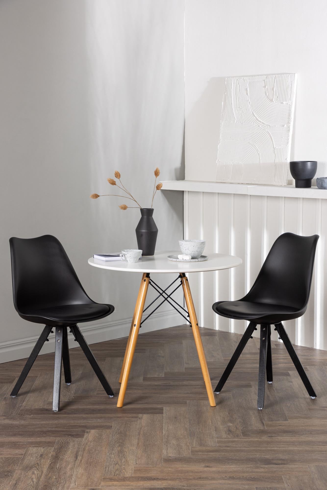 Elegantes Danburi Esstischset: Runder Tisch aus MDF, stabile Buchenholzbeine, komfortable Zeno Stühle, perfekt für intime Essbereiche.