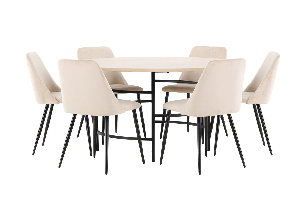 Rundes Esszimmerset Copenhagen mit Nachtstuhl von Venture Home: Tisch aus MDF in White Wash mit Metallgestell und sechs Samt-Stühlen mit schwarzen Beinen.