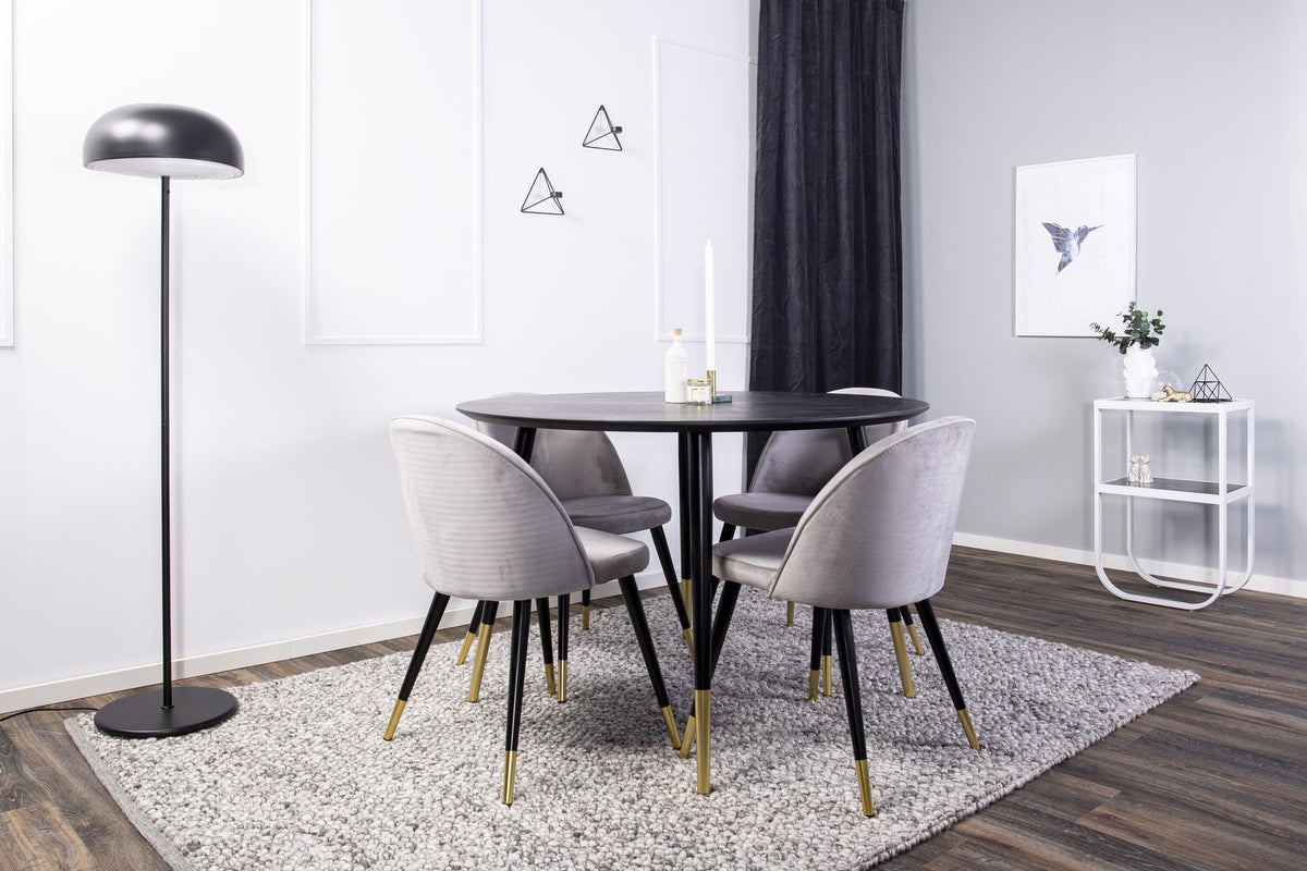 Rundes Dipp Esszimmerset: Esstisch ⌀115 cm mit schwarzem Furnier und schwarzen Beinen, dazu vier Velvet-Stühle mit schwarz-grauem Mikrofaserbezug.