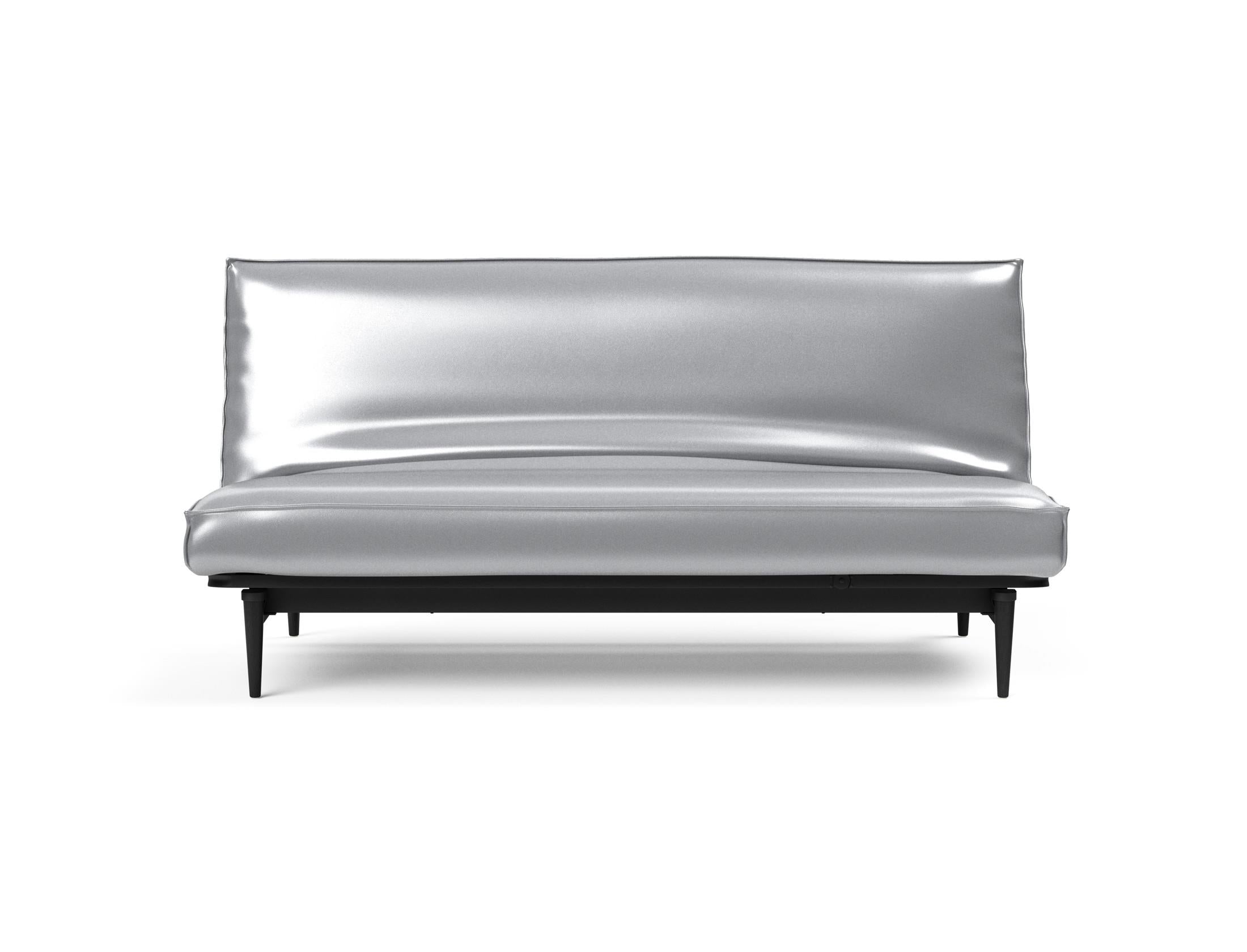 Stylisches Bettsofa Colpus 140 in elegantem Schwarz, kombiniert mit Eiche, perfekt für entspannte Stunden und flexible Wohnraumgestaltung.