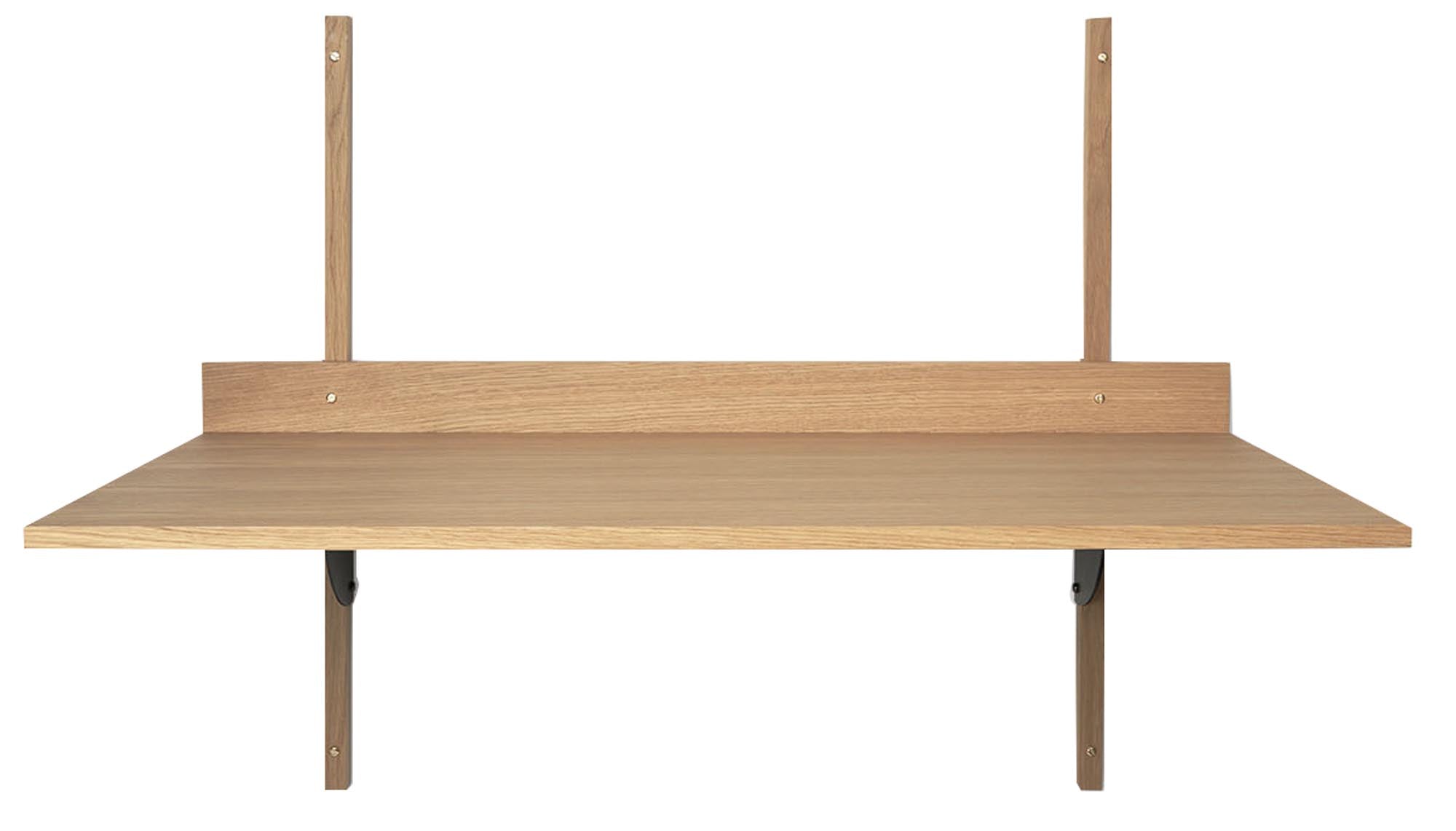 Eleganter Eichen-Schreibtisch mit raffinierten Messing-Elementen.