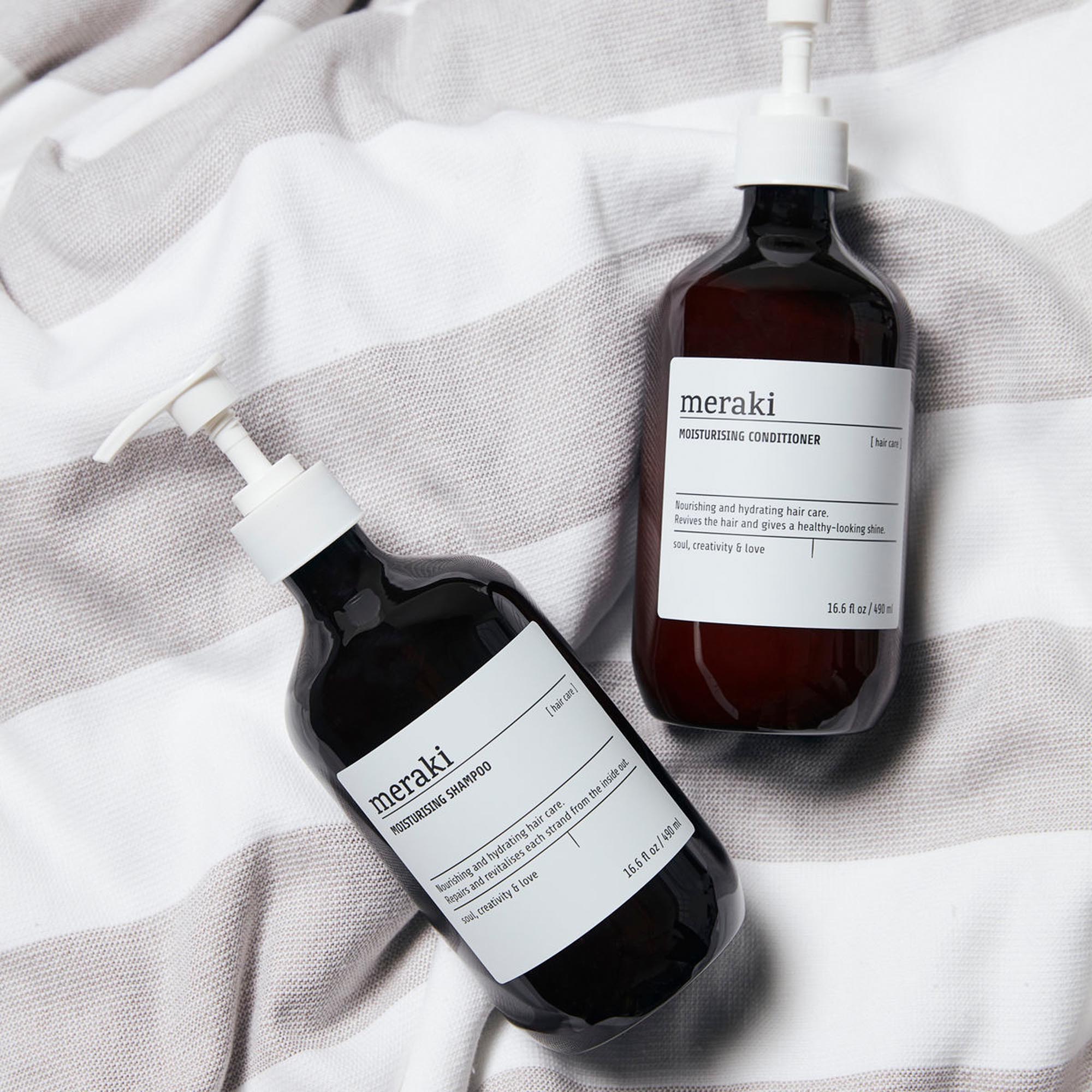 Luxuriöses, feuchtigkeitsspendendes Shampoo von Meraki in stilvollem Braun, ideal für die sanfte Reinigung und Pflege von trockenem Haar.