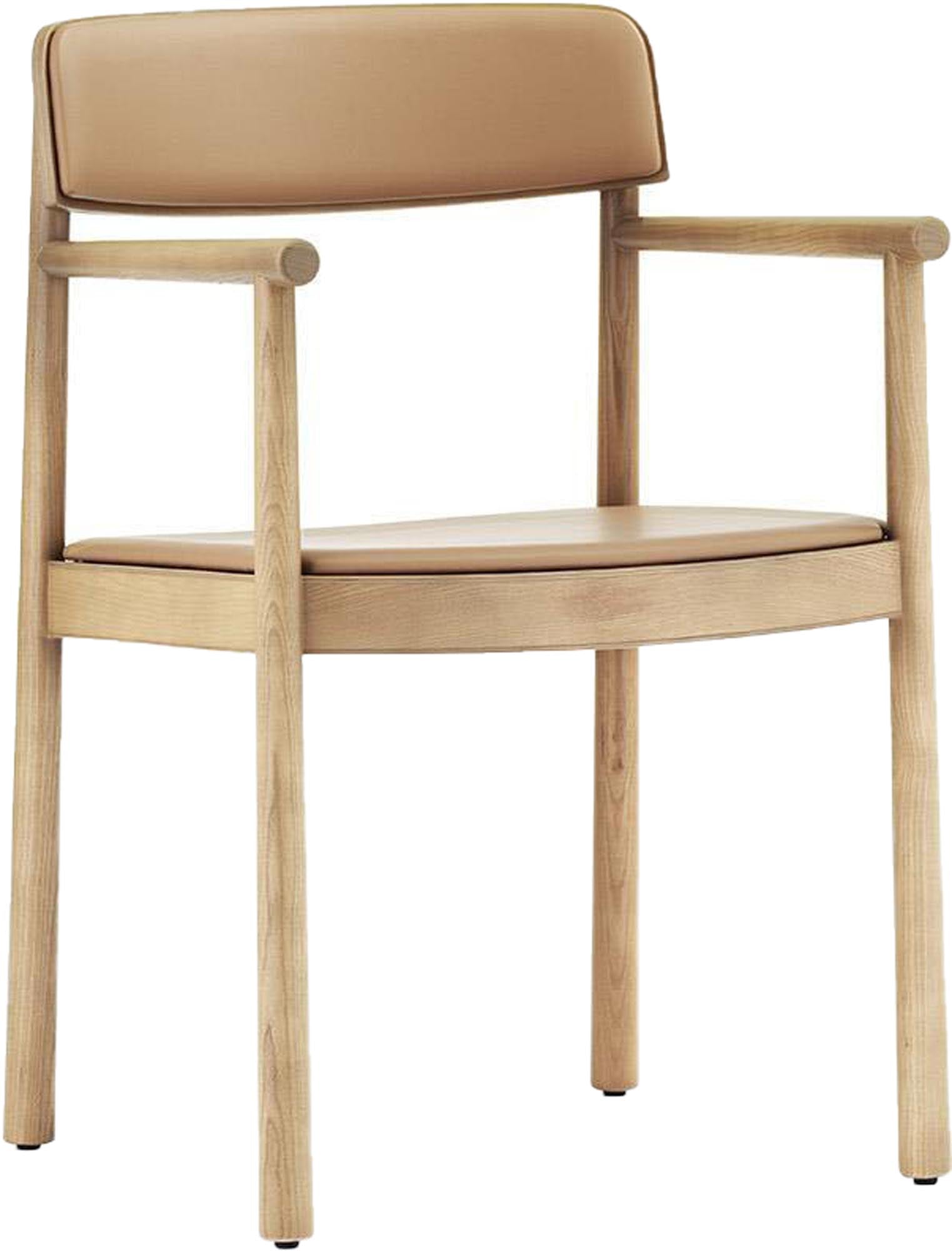 Der Timb Stuhl mit Armlehne von Normann Copenhagen vereint minimalistisches Design, hochwertige Materialien und komfortable Polsterung.