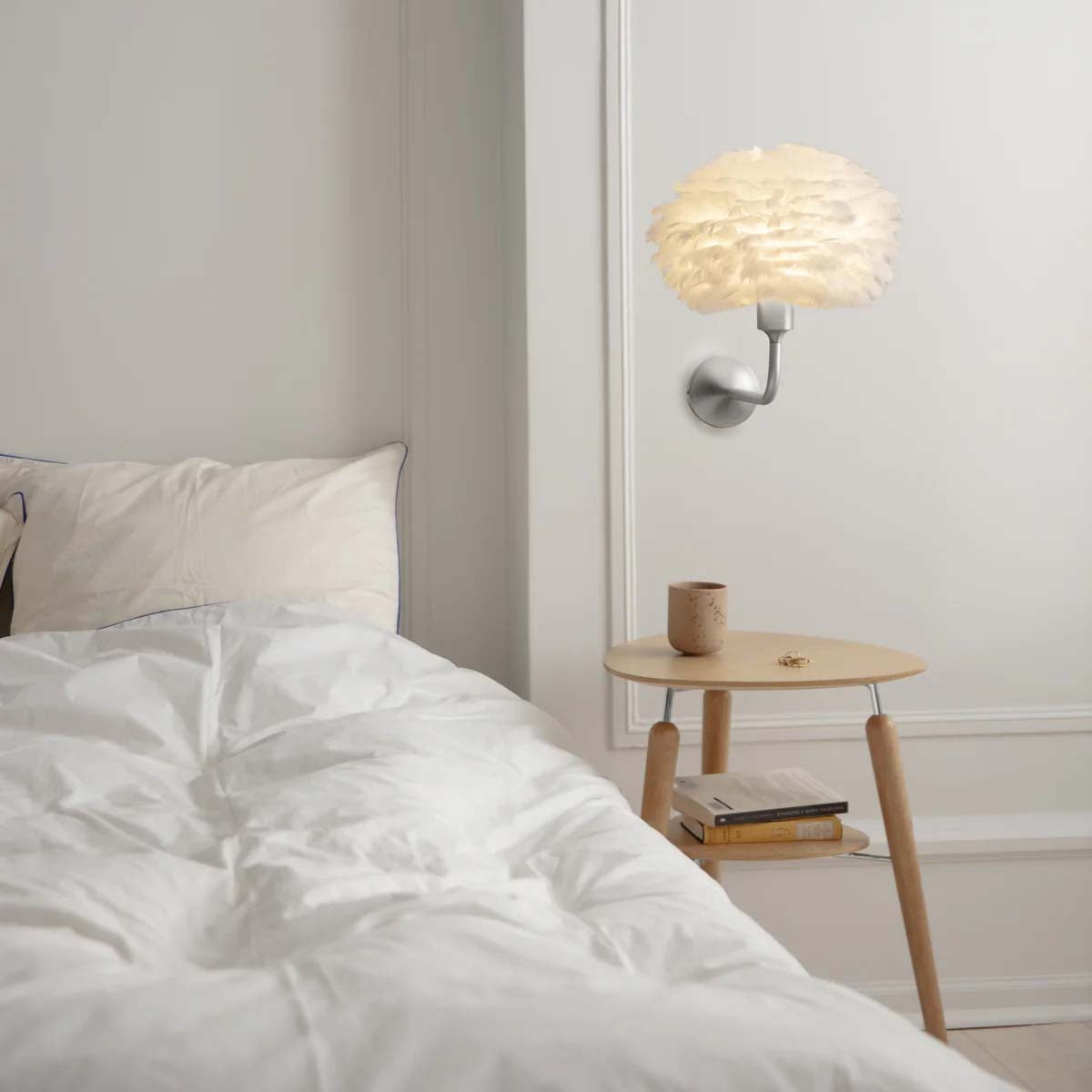 Umage Santé: Zeitlose Wandleuchte für ein elegantes Wohnambiente.