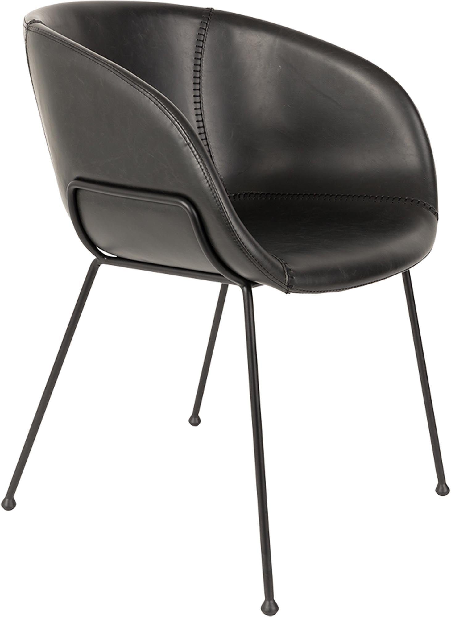 Entdecken Sie den Armlehnstuhl Feston von Zuiver: Ein stilvolles Möbelstück aus langlebigem PU-Leder, das Komfort und Eleganz vereint.