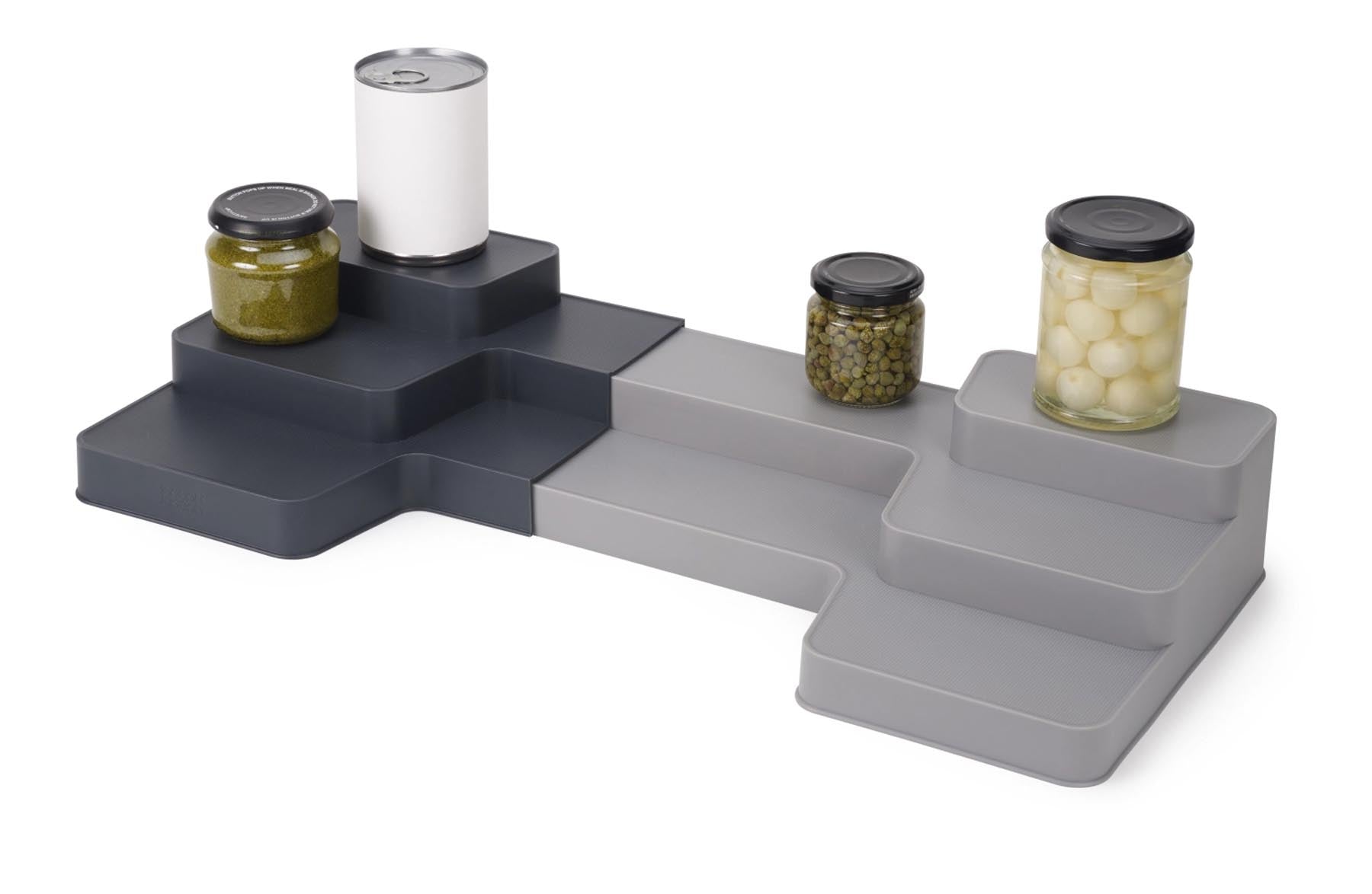 Praktischer und erweiterbarer Organizer für die Küche, perfekt zur optimalen Aufbewahrung von Geschirr und Utensilien in stilvollem Design.