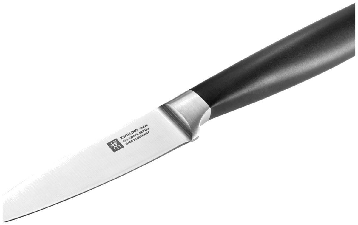 Zwilling Crave Schälmesser 10cm mit kurzer, spitzer Klinge und ergonomischem Griff, mehrfarbig, aufgenommen auf neutralem Hintergrund.