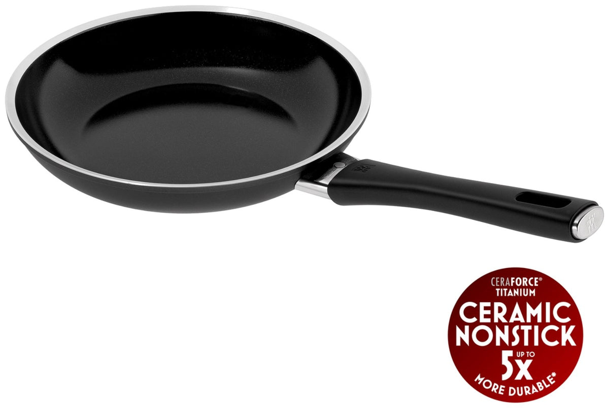 Schwarze Aluminium-Bratpfanne mit 24cm Durchmesser, Keramikbeschichtung, Temperaturindikator in der Pfannenmitte und flachem Induktionsboden.