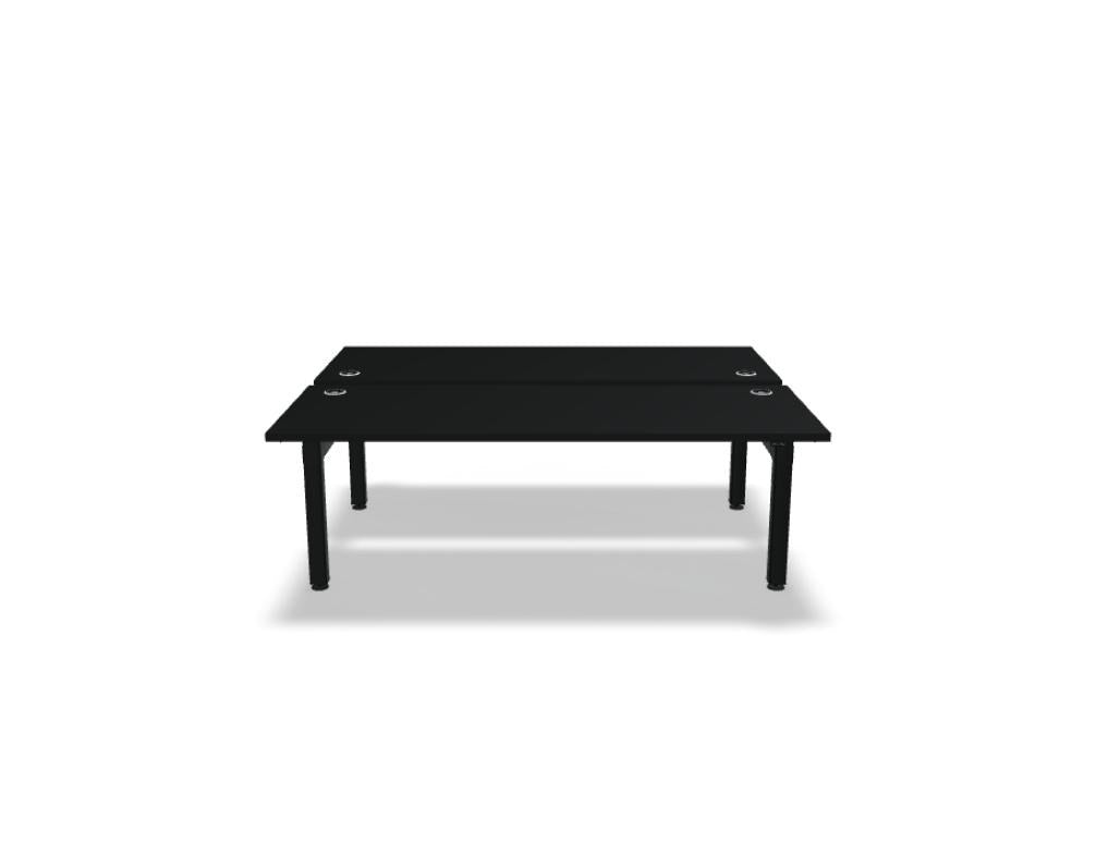 Doppelschreibtisch Ogi Drive Bench in Honigeiche mit schwarzem Metallgestell, zwei Teleskopsäulen und Bedienfeldern für Höhenverstellung.
