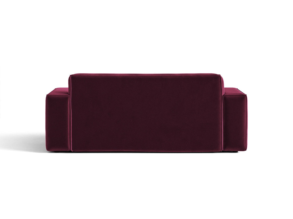 Zweisitzer-Sofa Jodie von Micadoni mit beigem Samtbezug, schwarzen Kunststoffbeinen und gepolsterter Rückenlehne, Frontalansicht.