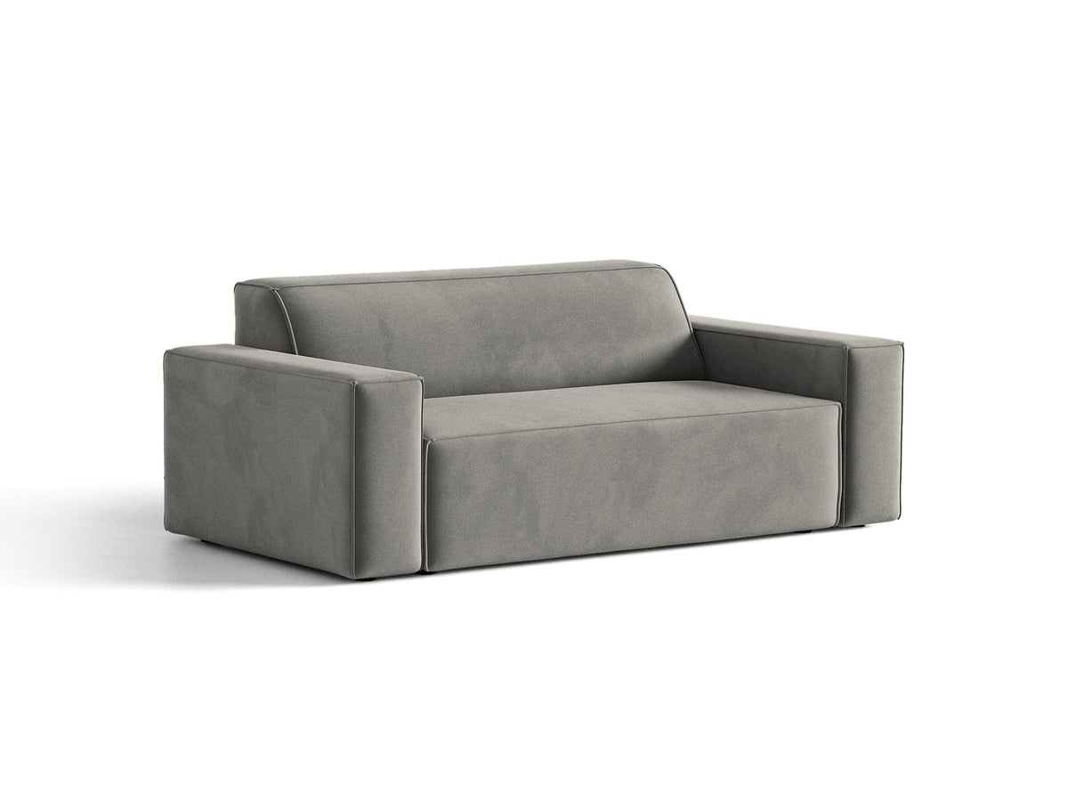 Zweisitzer-Sofa Jodie von Micadoni mit beigem Samtbezug, schwarzen Kunststoffbeinen und gepolsterter Rückenlehne, Frontalansicht.
