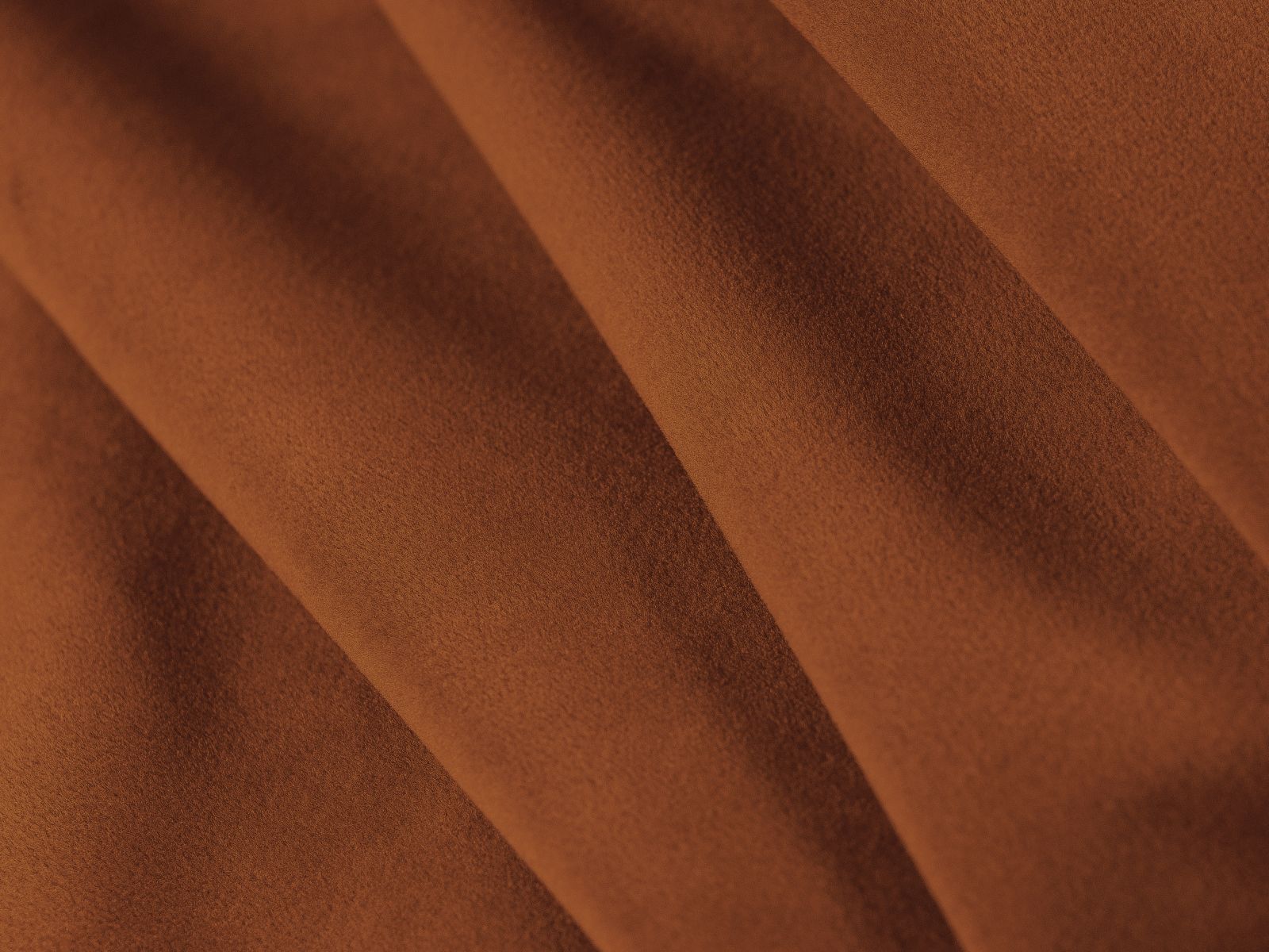 Stylisches 3-Sitzer Sofa Dormi in warmem Terracotta, perfekt für entspannte Abende und als praktisches Schlafsofa für Übernachtungsgäste.
