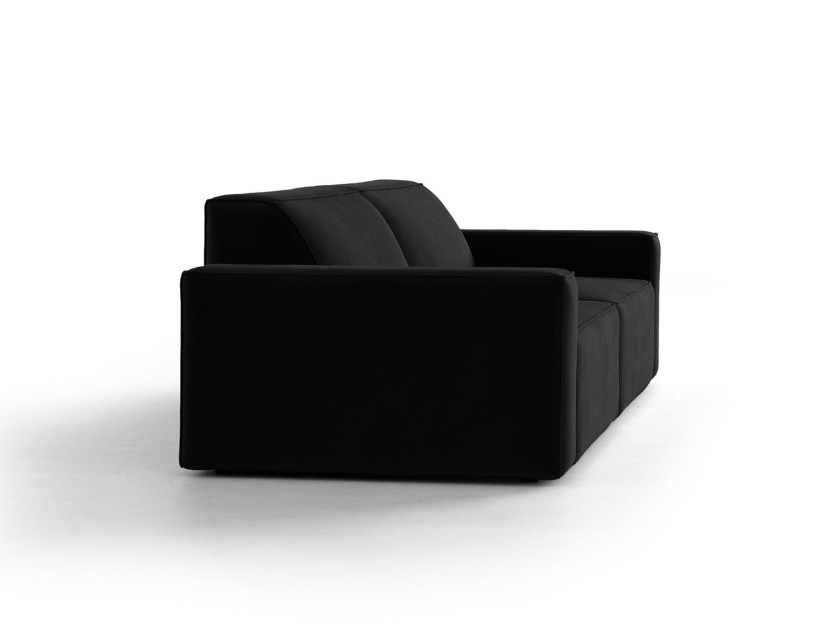 Modulares 4er Sofa Jodie von Micadoni in leichtem Beige mit Venus Samtstoff, schwarzen Kunststoffbeinen und niedriger Rückenlehne.
