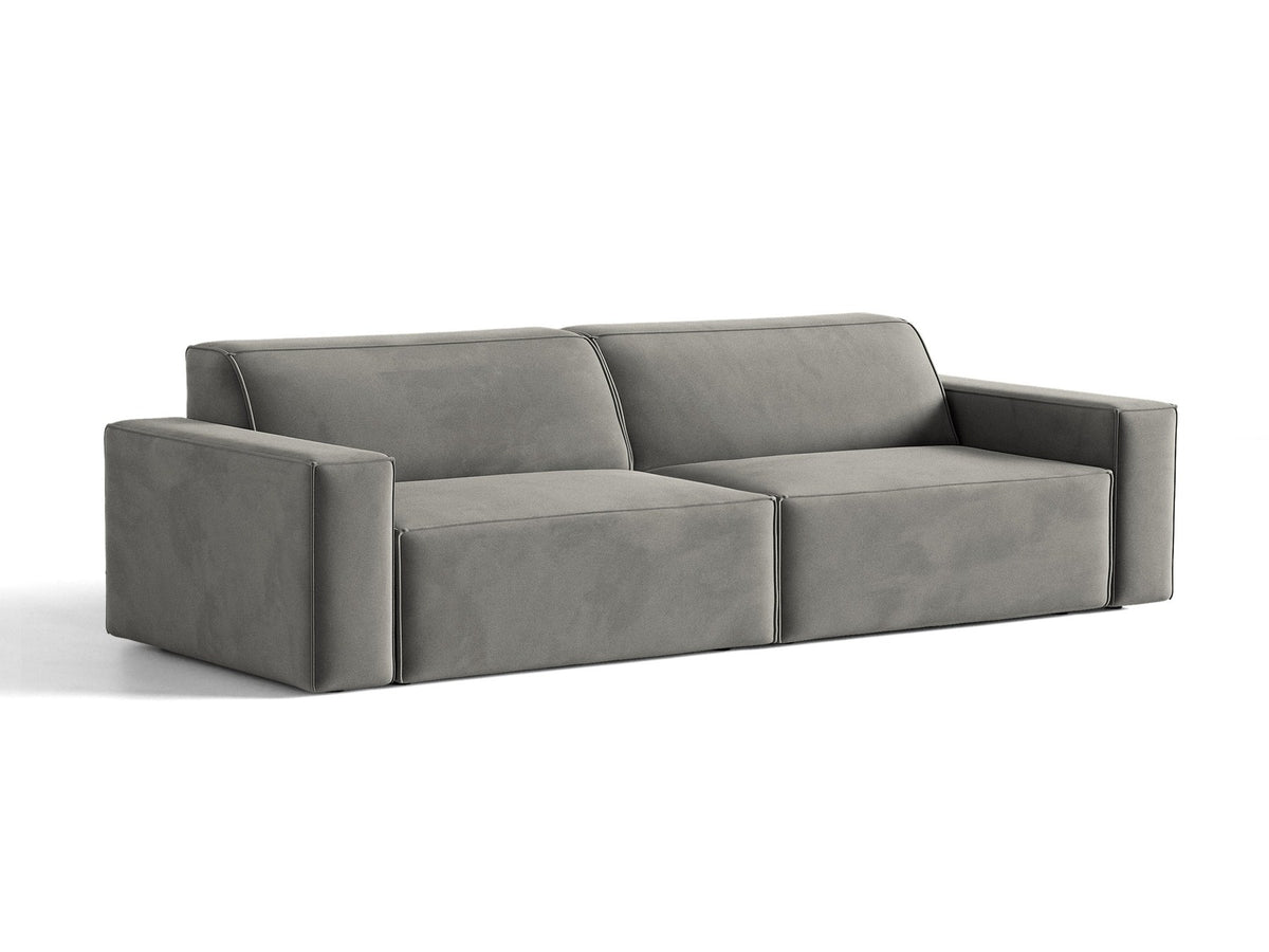 Modulares 4er Sofa Jodie von Micadoni in leichtem Beige mit Venus Samtstoff, schwarzen Kunststoffbeinen und niedriger Rückenlehne.