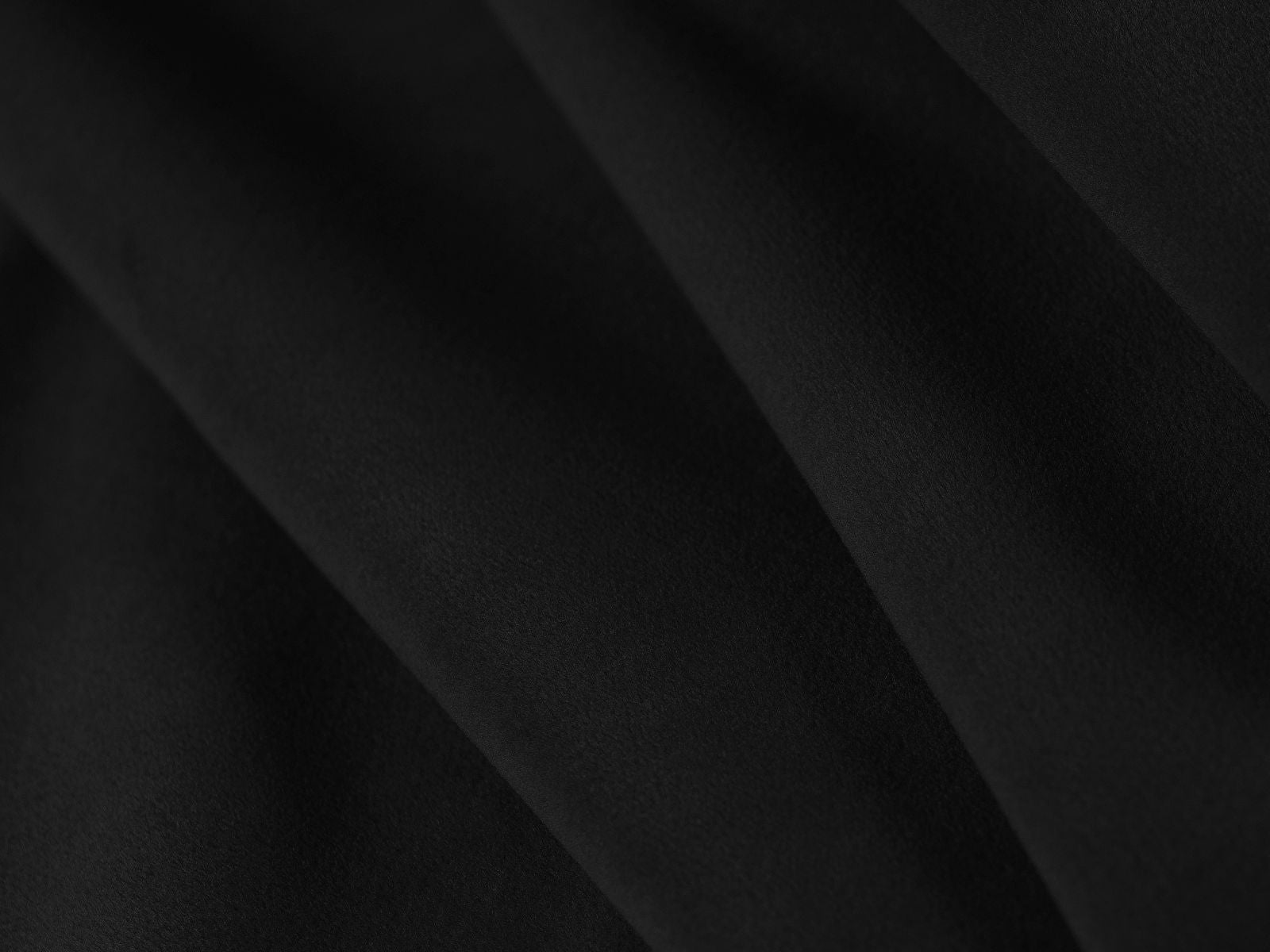 Modernes Ovalo Bett in 160 cm Breite, bietet cleveren Stauraum und ein ansprechendes Kopfteil aus hochwertigem Black-Magic Velvet.