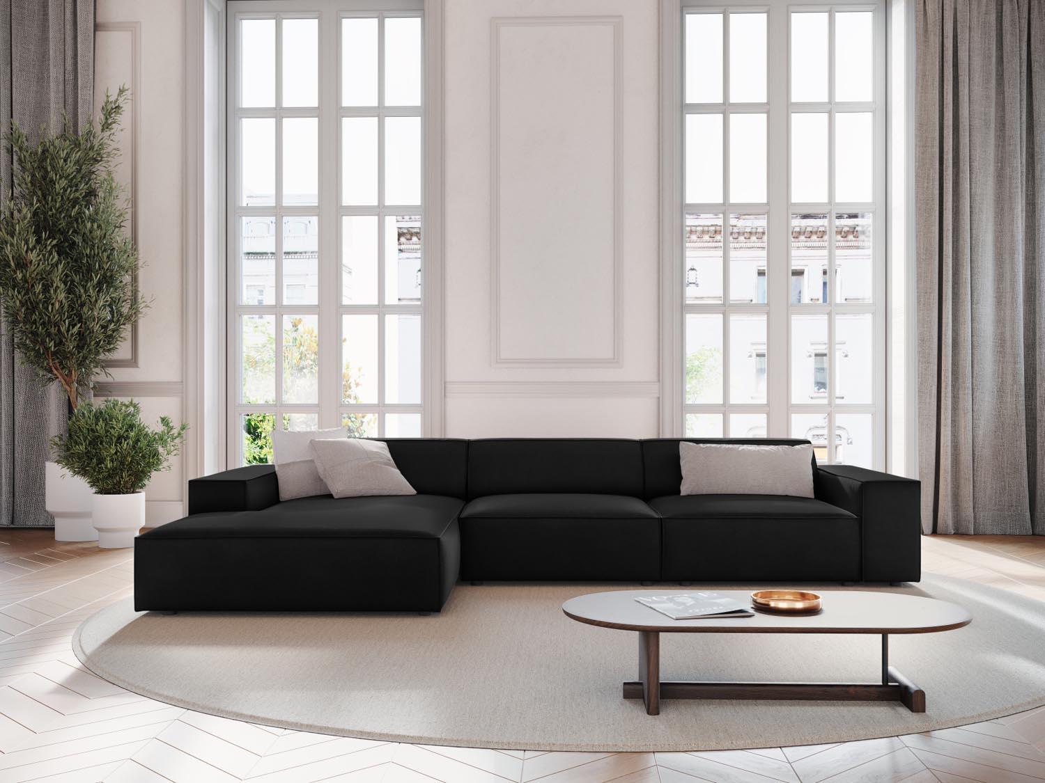 Elegantes Jodie Velour Ecksofa in Schwarz-Bluvel, modulares Design, ideal für stilvolle Wohnräume, präsentiert in gemütlicher Atmosphäre.