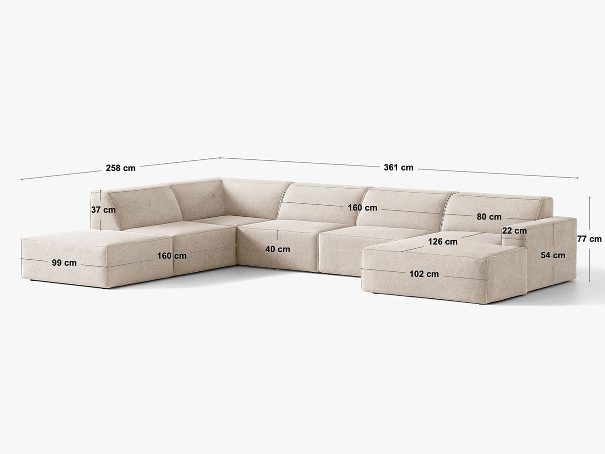 Modulares Ecksofa links Jodie von Micadoni in leichtem Beige mit Venus-Samtstoff, schwarzen Kunststoffbeinen und Panoramaform.