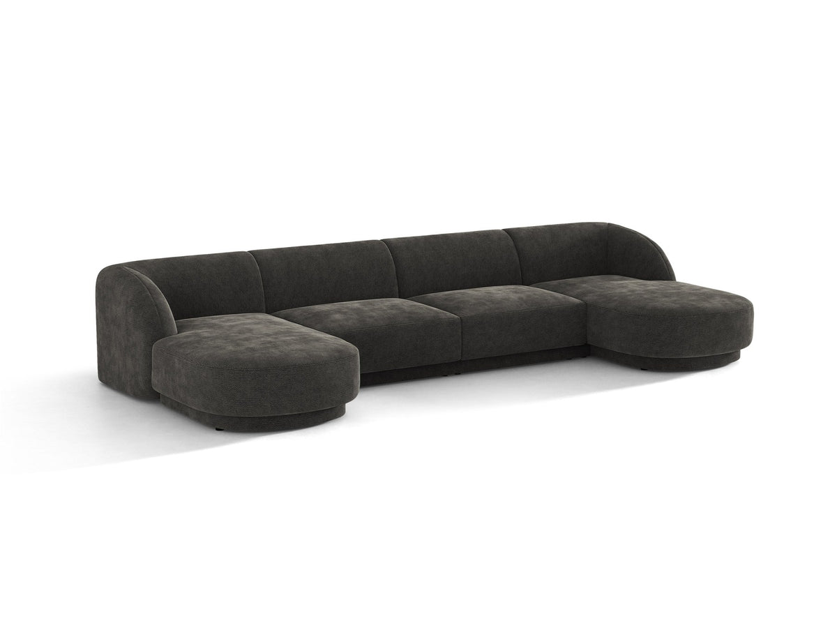 Dunkelbeiges Panorama-Ecksofa Miley von Micadoni mit Bluvel-Stoffbezug, L-Form, schwarzen Kunststoffbeinen und niedriger Rückenlehne.
