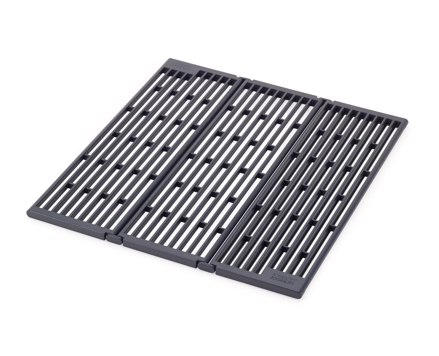 Kompakte faltbare Abtropfschale von Joseph Joseph, ideal für Spülen, platzsparend und praktisch für moderne Küchen.