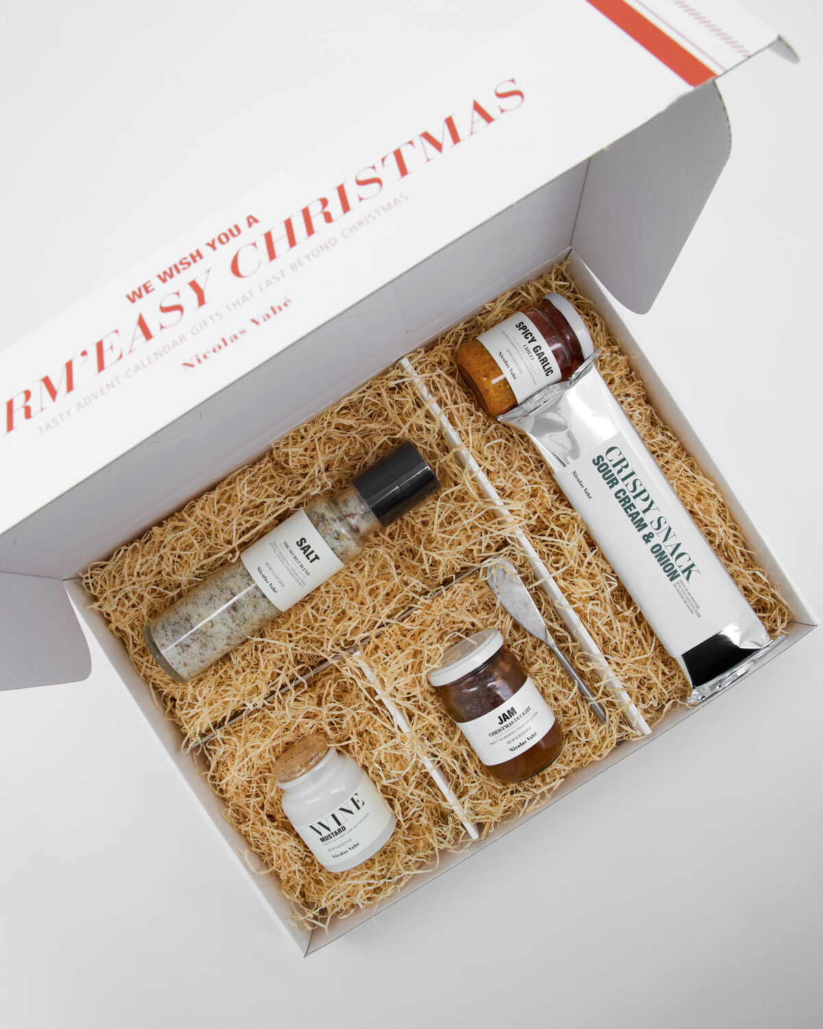 Stilvolle Geschenkbox von Nicolas Vahé für den Advent 2026, prall gefüllt mit feinen Leckereien und ansprechendem Design.