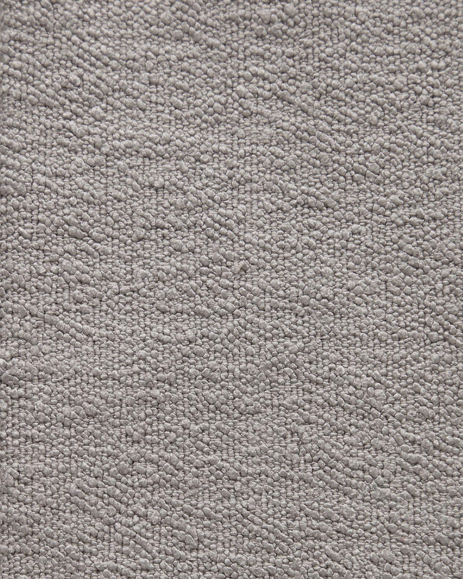 Eleganter Candela Sessel in Grau aus weichem Mikro-Bouclé. Ideal für dein Wohnzimmer, bietet er höchsten Komfort und nachhaltige Qualität.