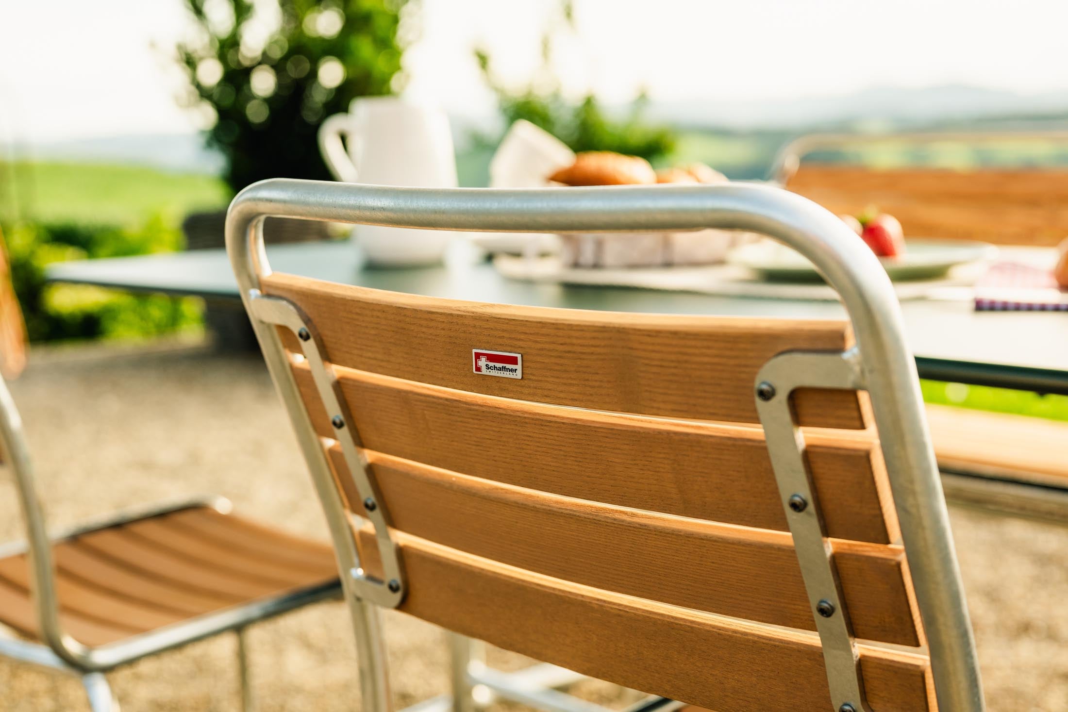 Rigi Holzlatten-Gartenstuhl ohne Armlehne in Natur geölt präsentiert im Onlineshop von KAQTU Design AG. Gartenstuhl ist von Schaffner
