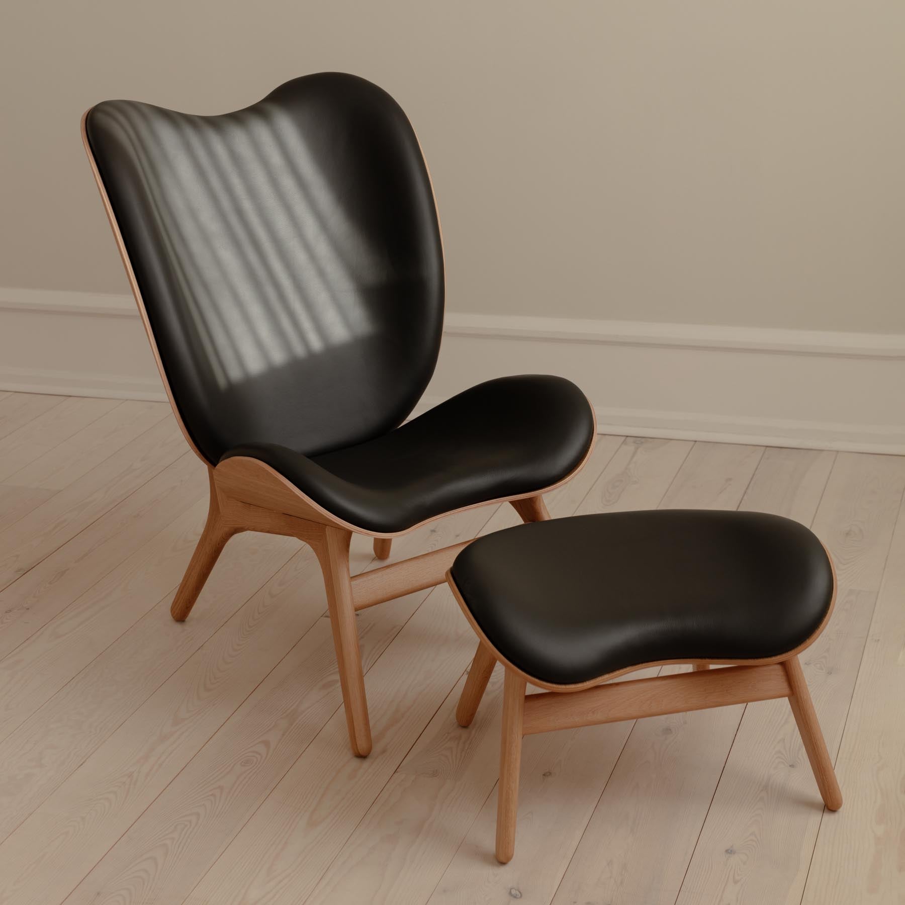 Schicker, runder Ottoman in Schwarz von Umage, perfekt für entspannte Momente und stilvolle Einrichtungsideen in Ihrem Zuhause.