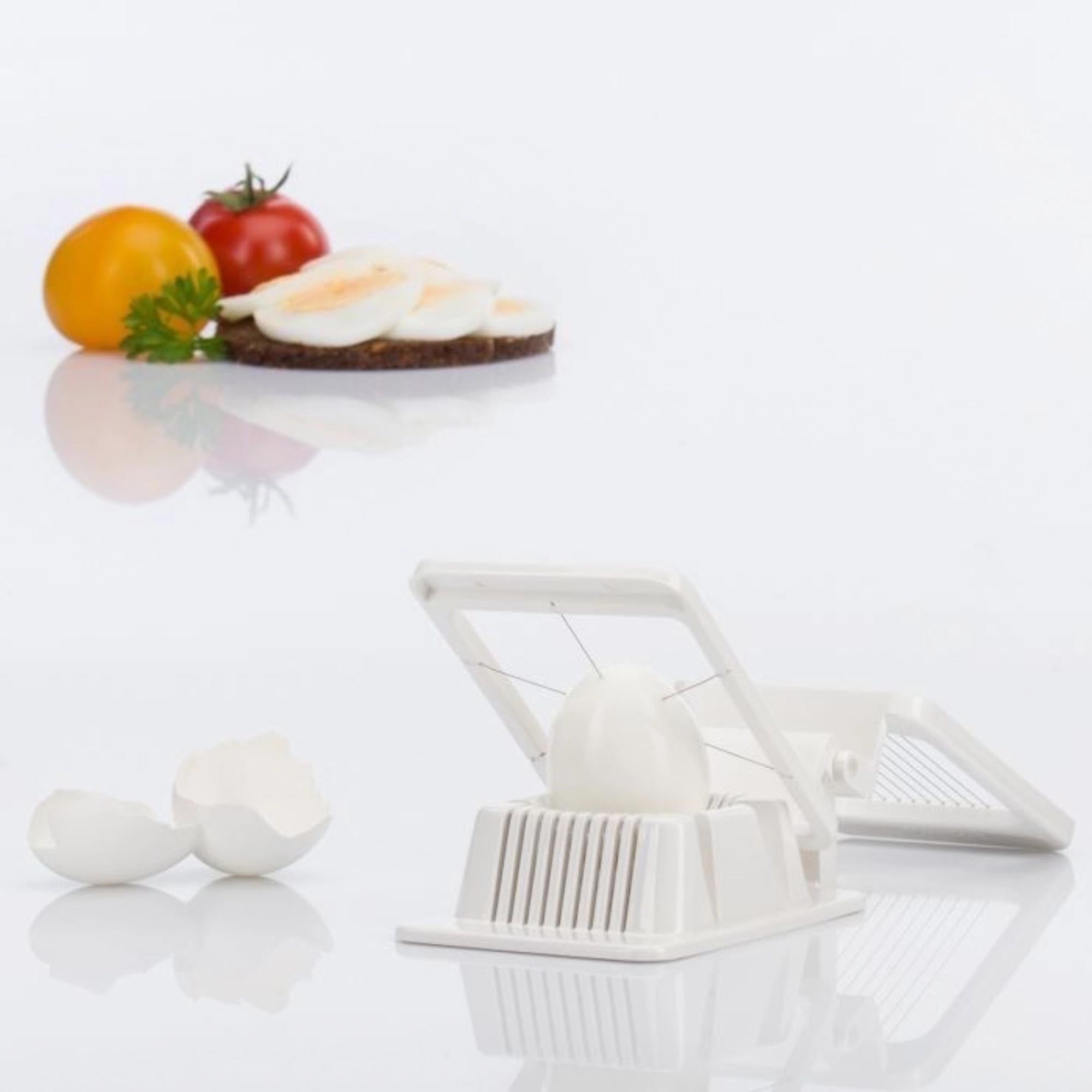 Kompakter Kombi-Eierteiler von Westmark, perfekt zum Schneiden und Teilen von Eiern, Masse 13.5x8.5x4cm, vielseitig und praktisch.