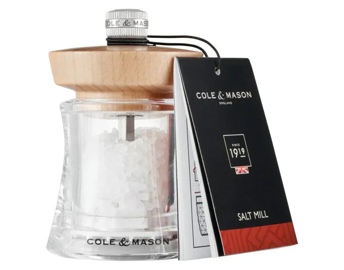 Elegante Salzmühle aus Acryl und Buche, kompakt und stilvoll, ideal für präzises Würzen in der Küche oder am Tisch.