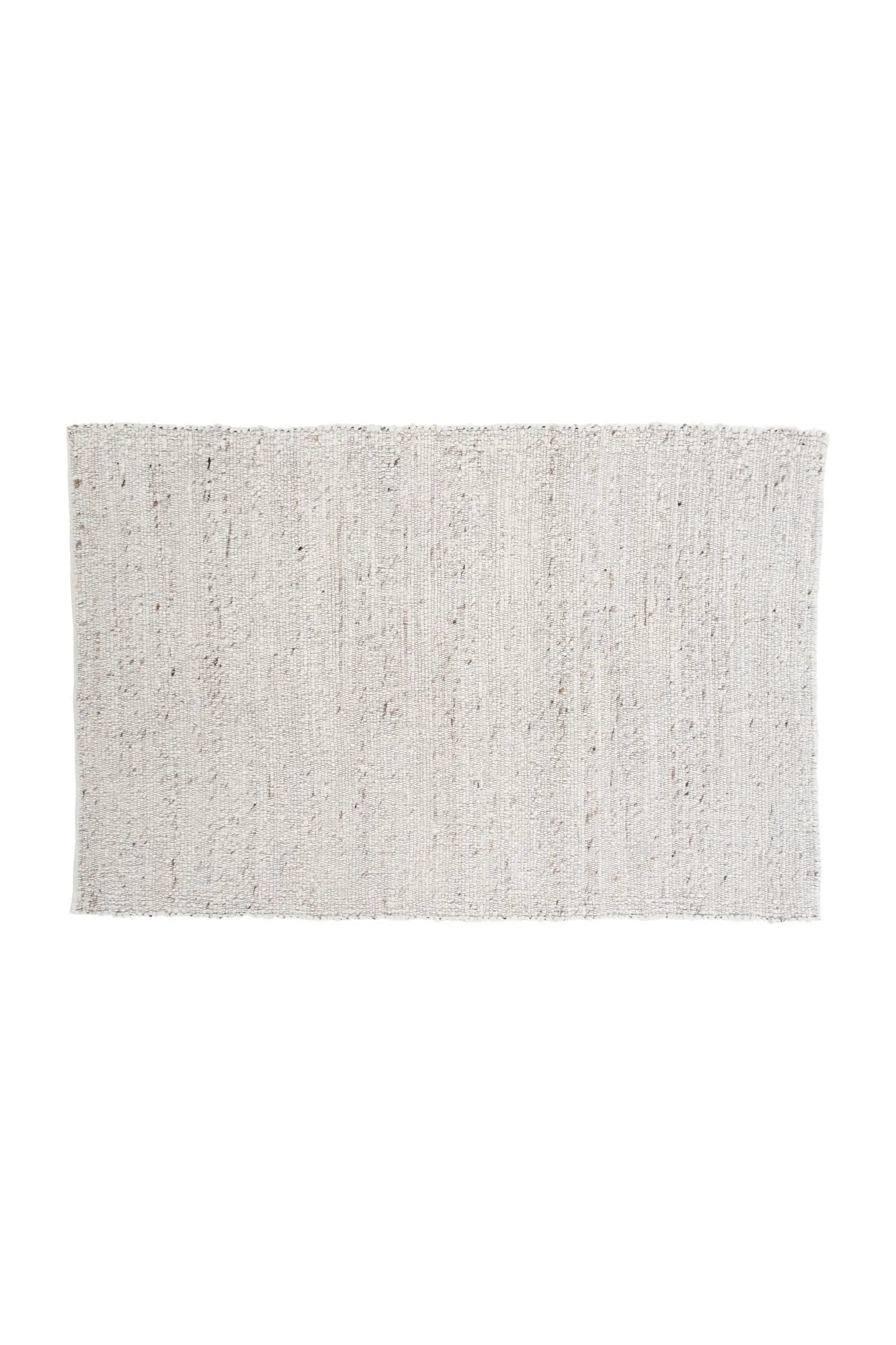 Der Loump Teppich von Venture Home ist ein handgewebter Wollteppich in Knochen- und Beigetönen mit gesprenkeltem Muster, 230x160 cm.
