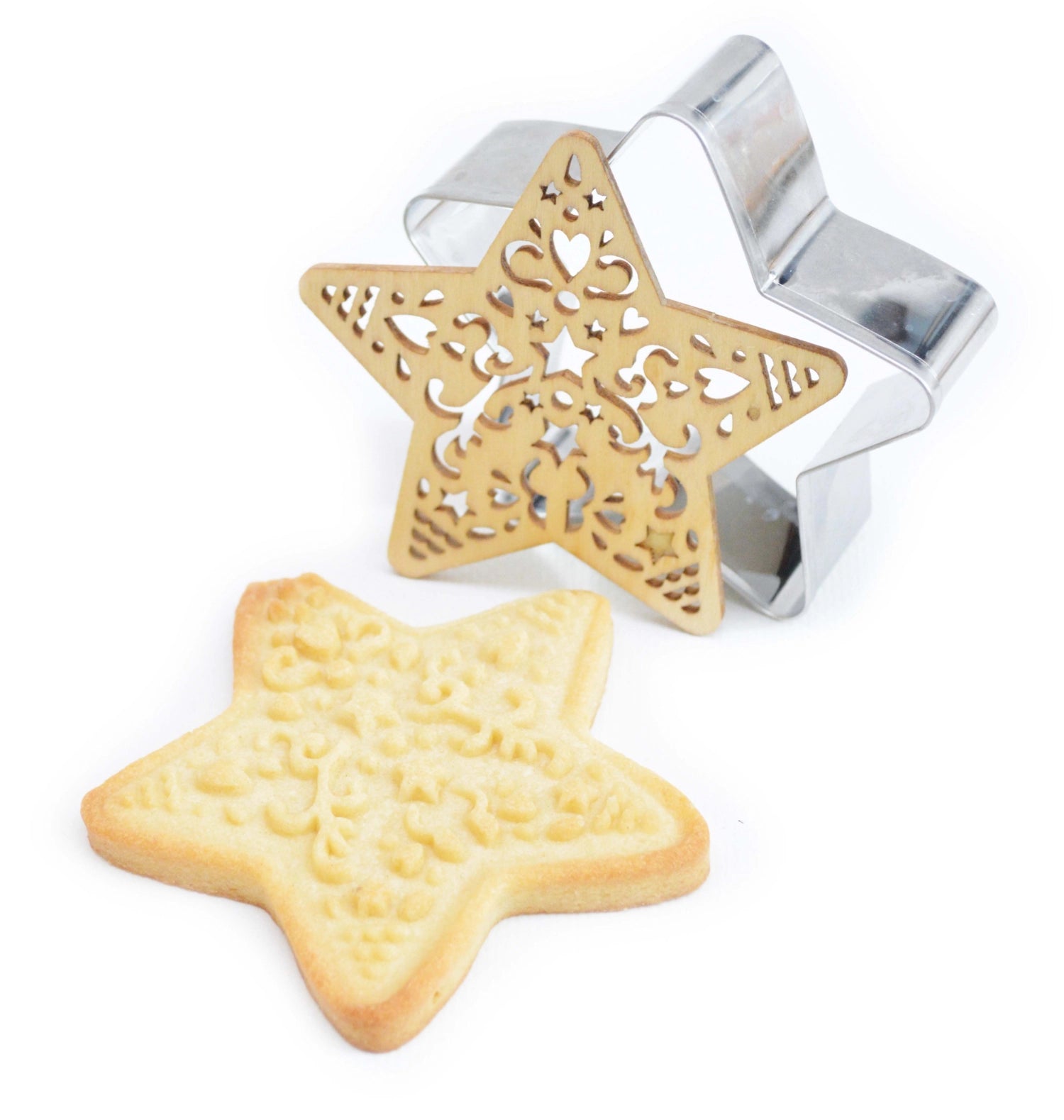 Sternförmige Ausstechform und Holzpräger von Scrap Cooking, perfekt für kreative Weihnachtsbäckerei und festliche Plätzchen.