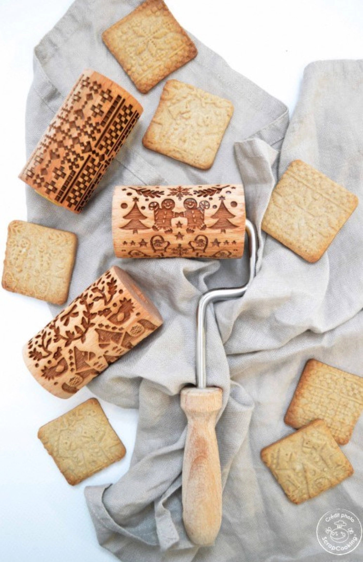 3 Rouleaux de pâte avec un gaufrage de Noël