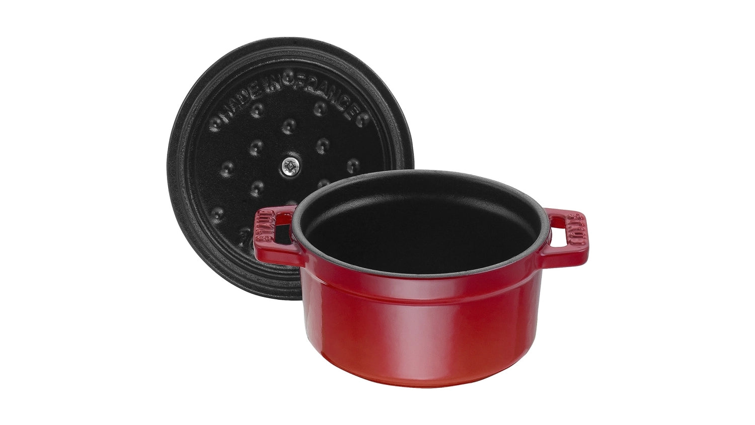 Kompakte Mini Cocotte in leuchtendem Kirsch-Rot, 10 cm Durchmesser, aus robustem Gusseisen, perfekt für individuelle Portionen und ansprechende Präsentation.